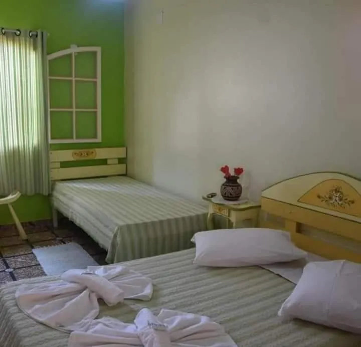 Bed in Pousada Oca Porã