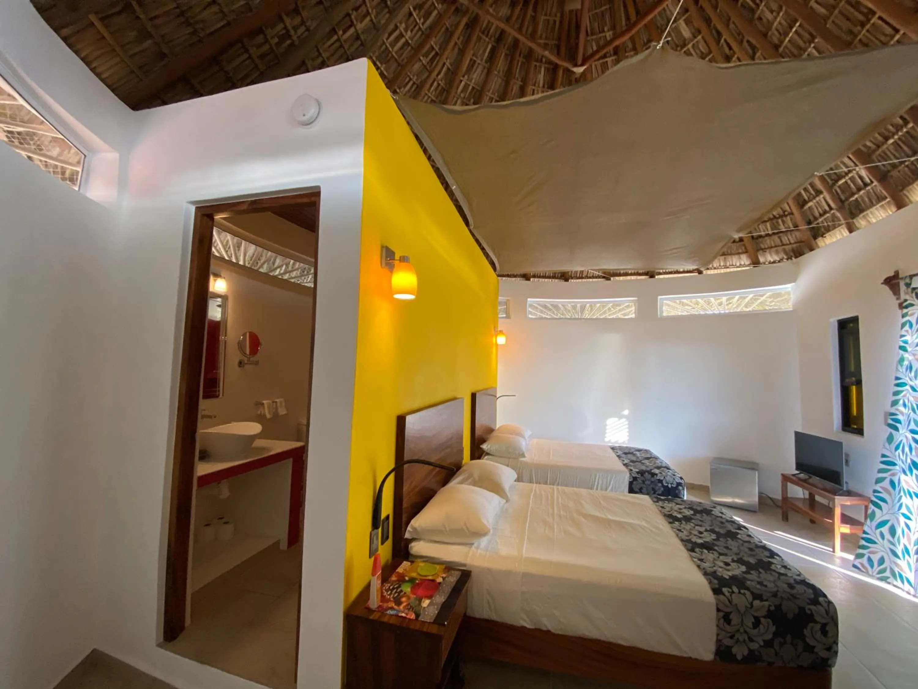 Bed in Beachfront Paradise Boutique Hotel