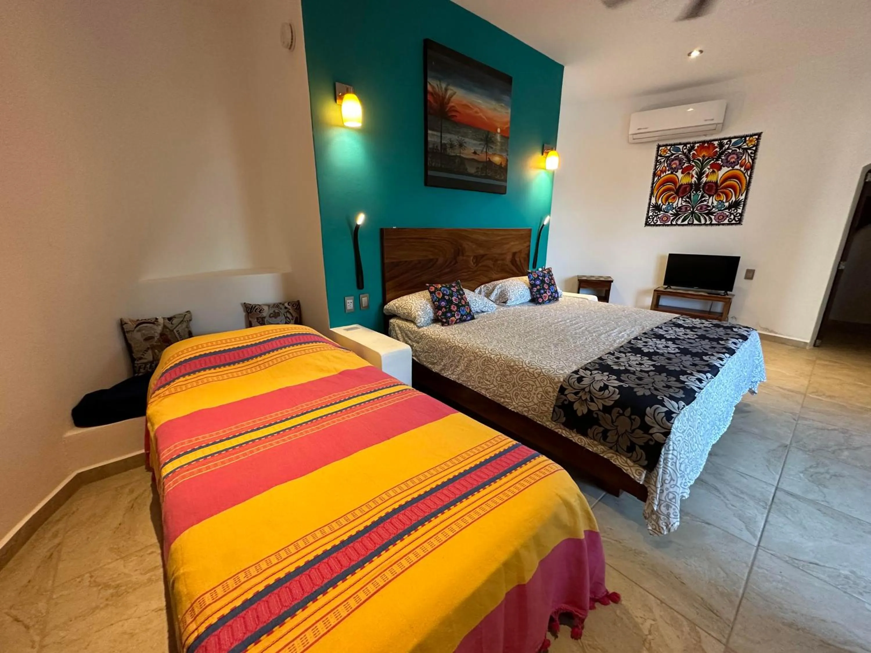 Photo of the whole room, Bed in Beachfront Paradise Boutique Hotel