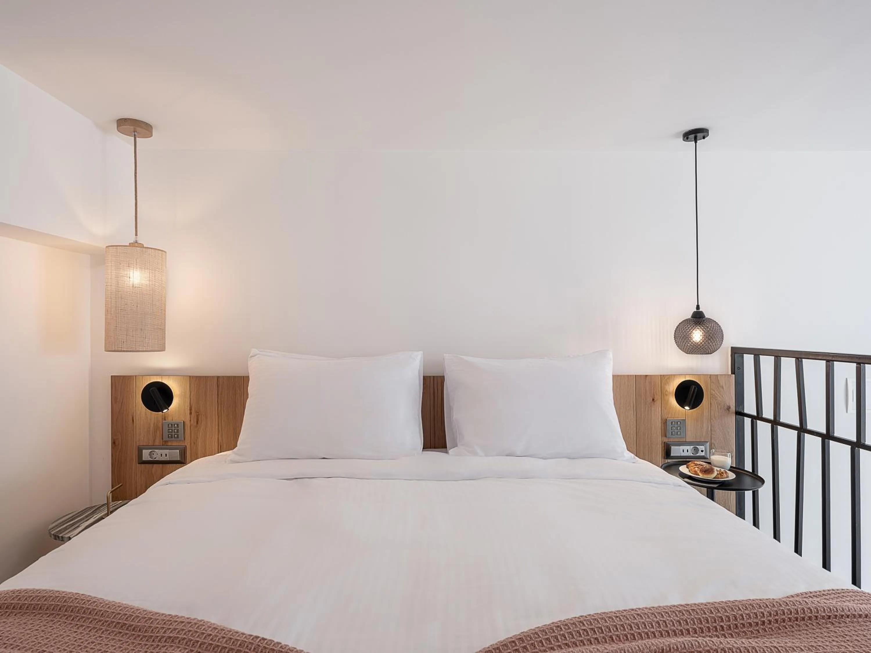 Bed in Calla Luxury Seafront Suites