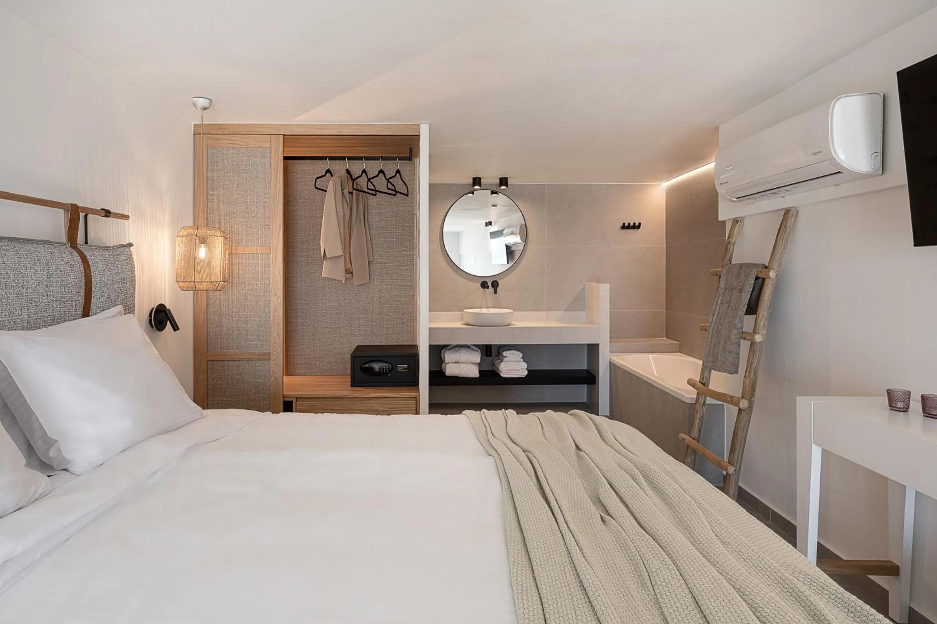 Bed in Calla Luxury Seafront Suites