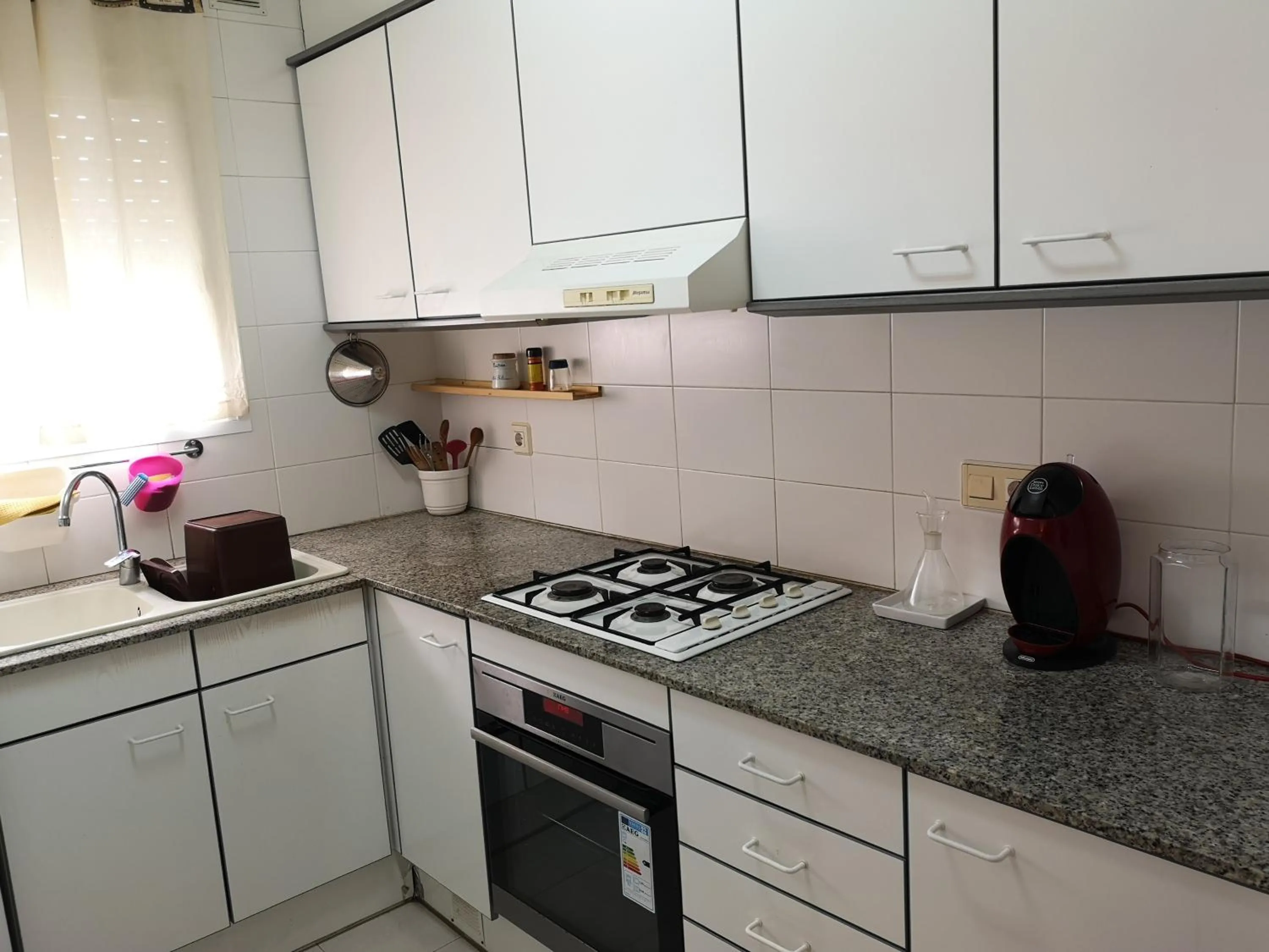 Kitchen or kitchenette in LLOGUER30 Apartamento Lotus, piscina y parquing