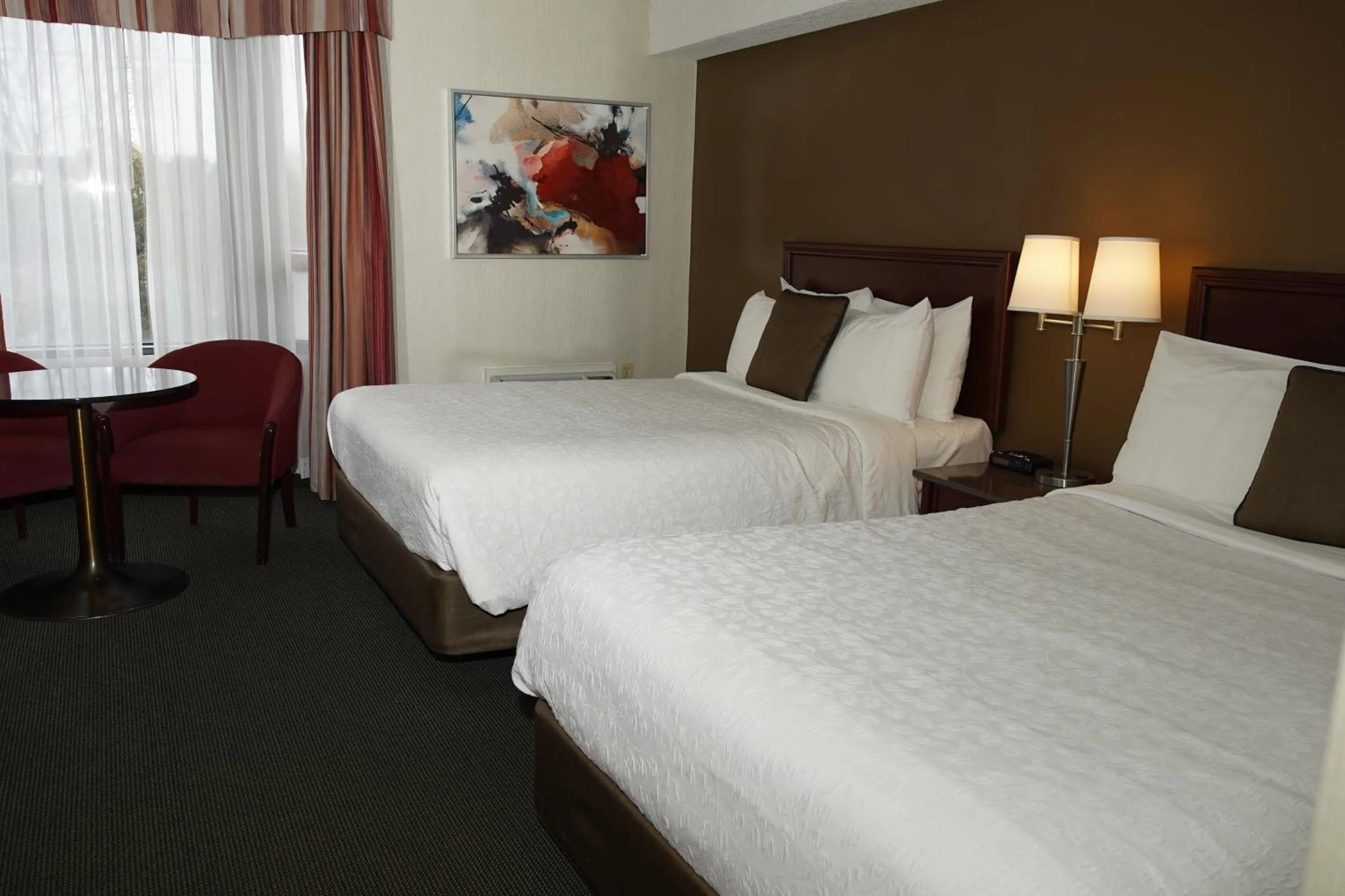 Bed in Hôtel WelcomInns