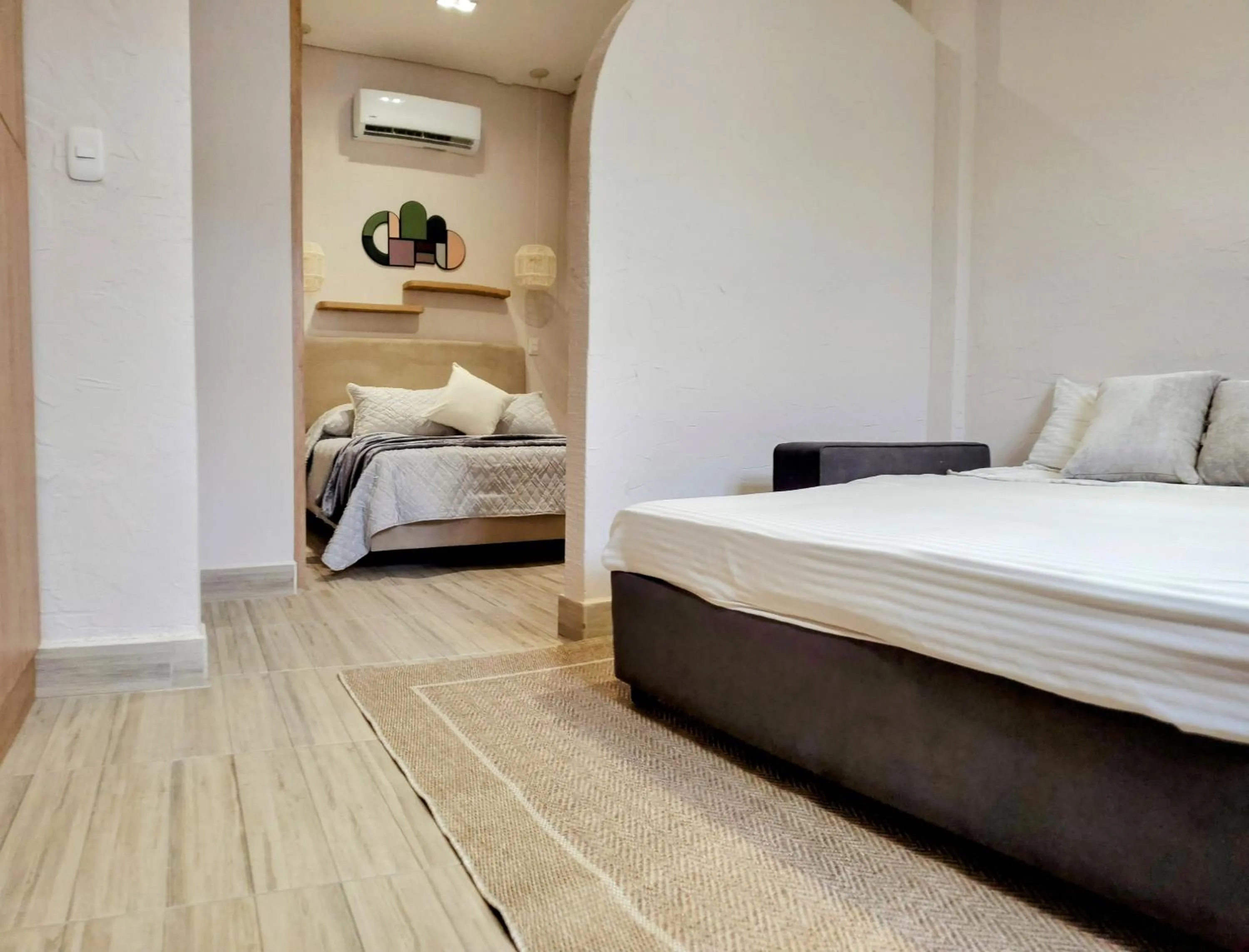 Photo of the whole room, Bed in Zentrico Boutique