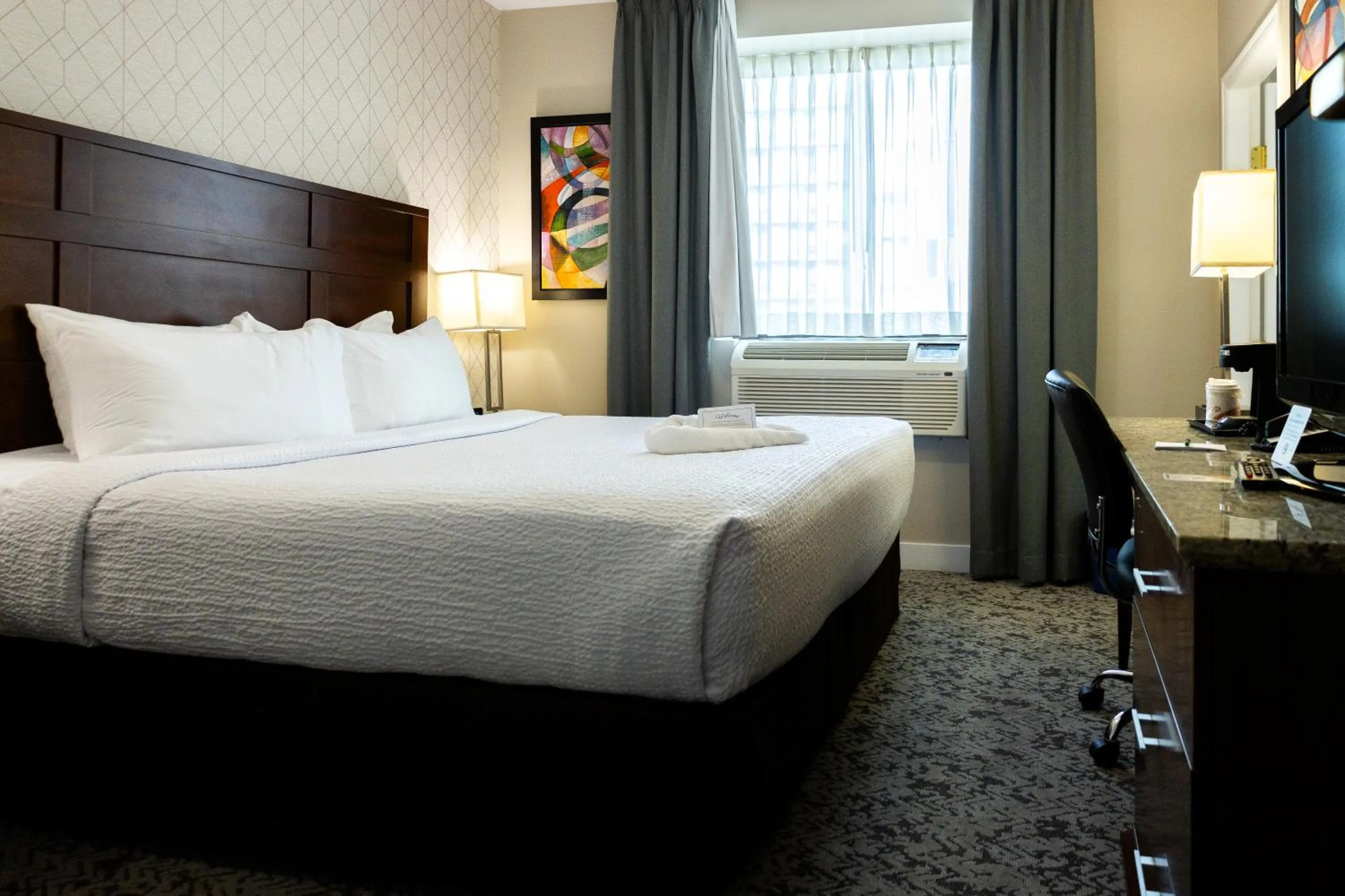 Bed in Quality Inn & Suites