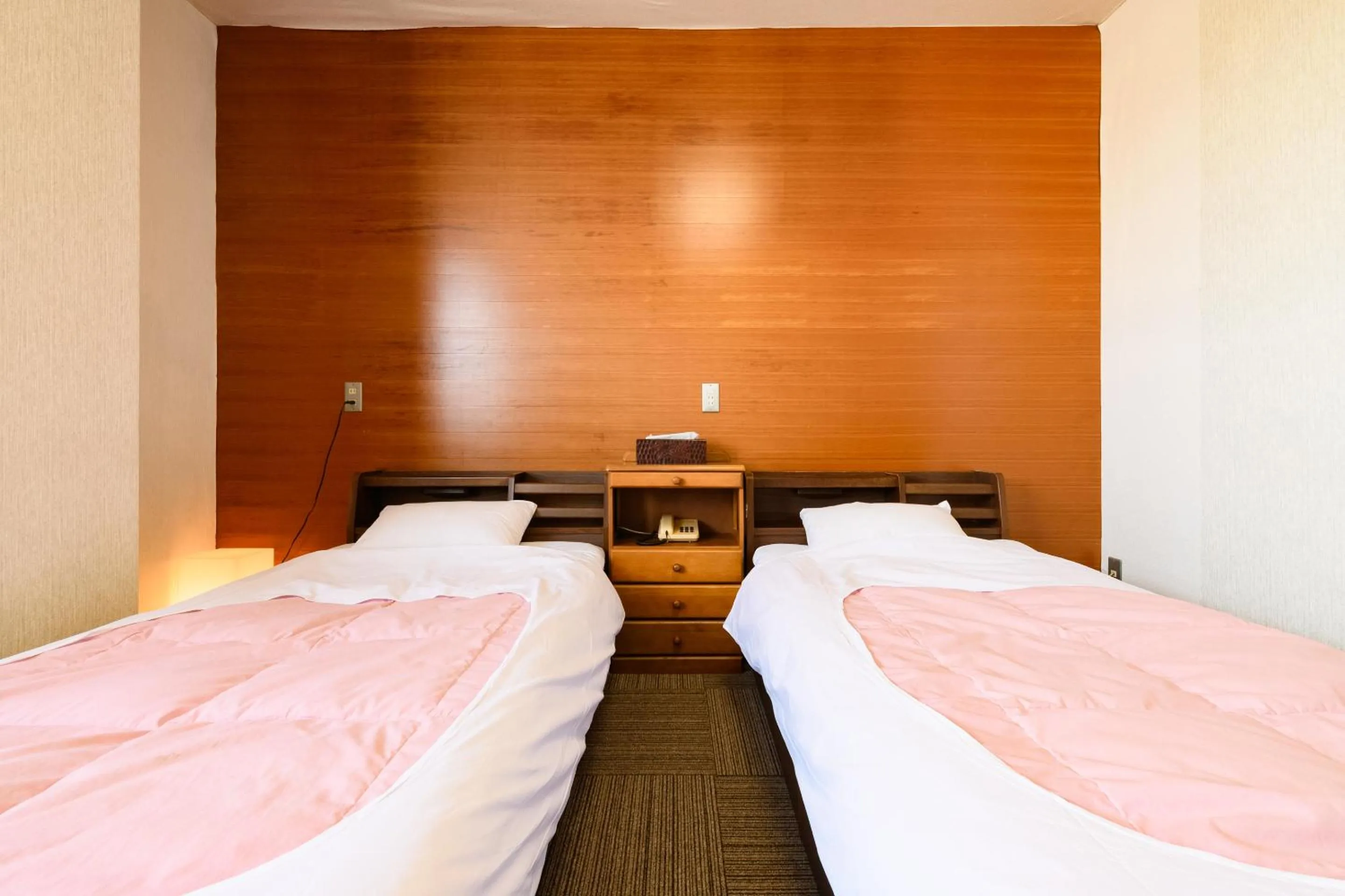 Bed in Tabist HotelNakajima Fuji