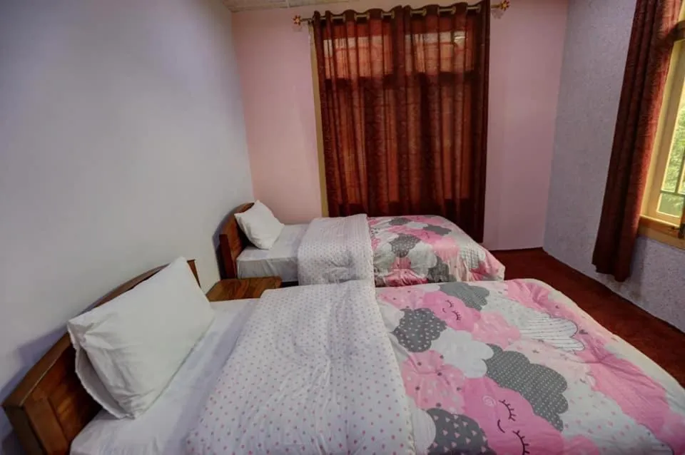 Bed in MasakAli Family Guest House