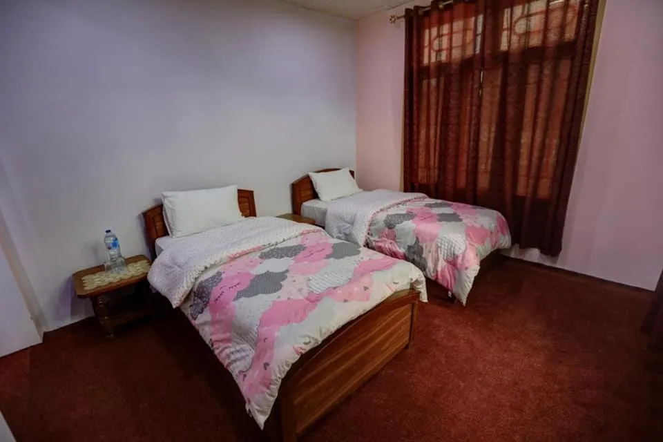 Bed in MasakAli Family Guest House