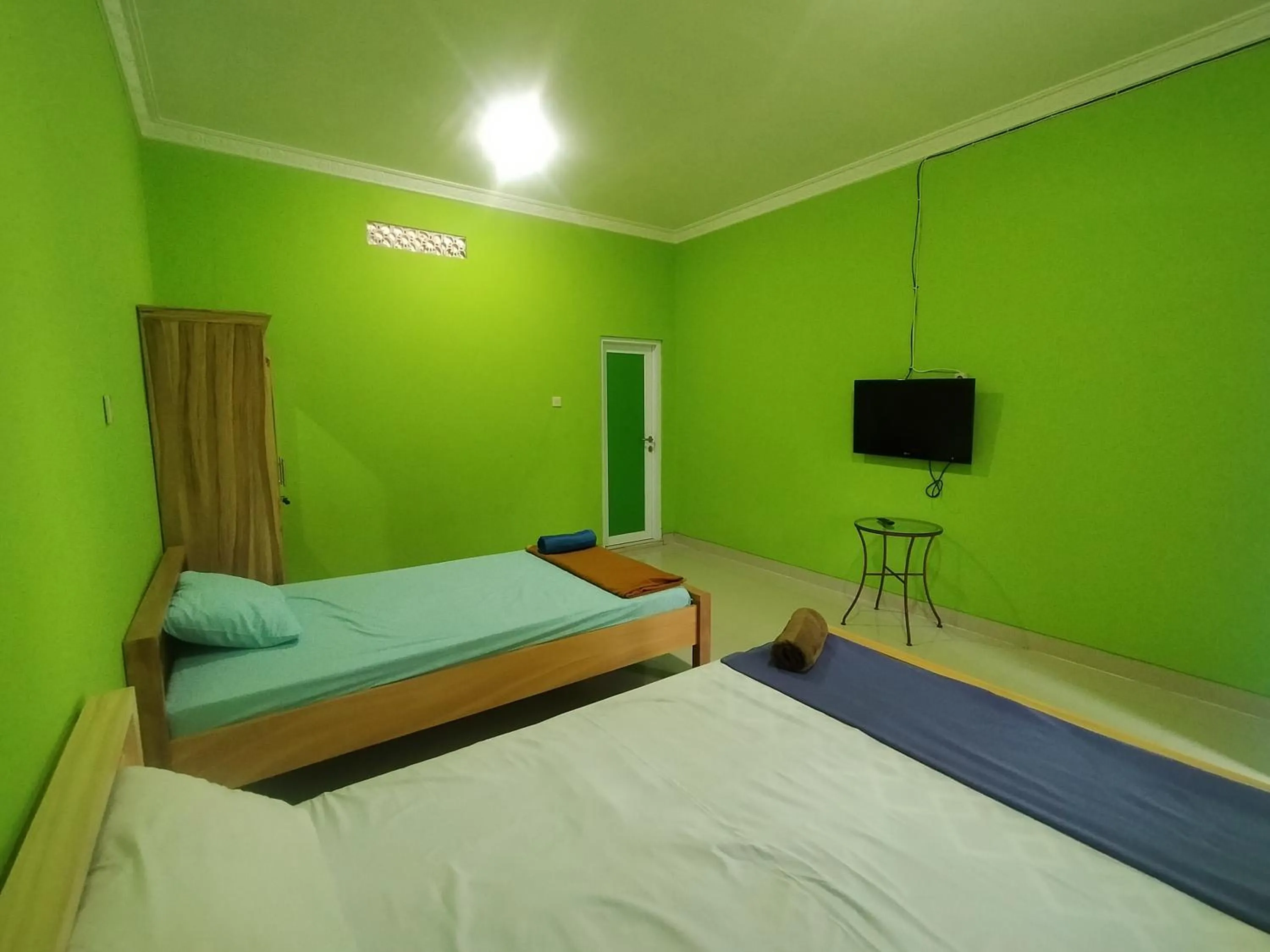 Bed in Villa Batu Tua Puncak Mitra RedDoorz