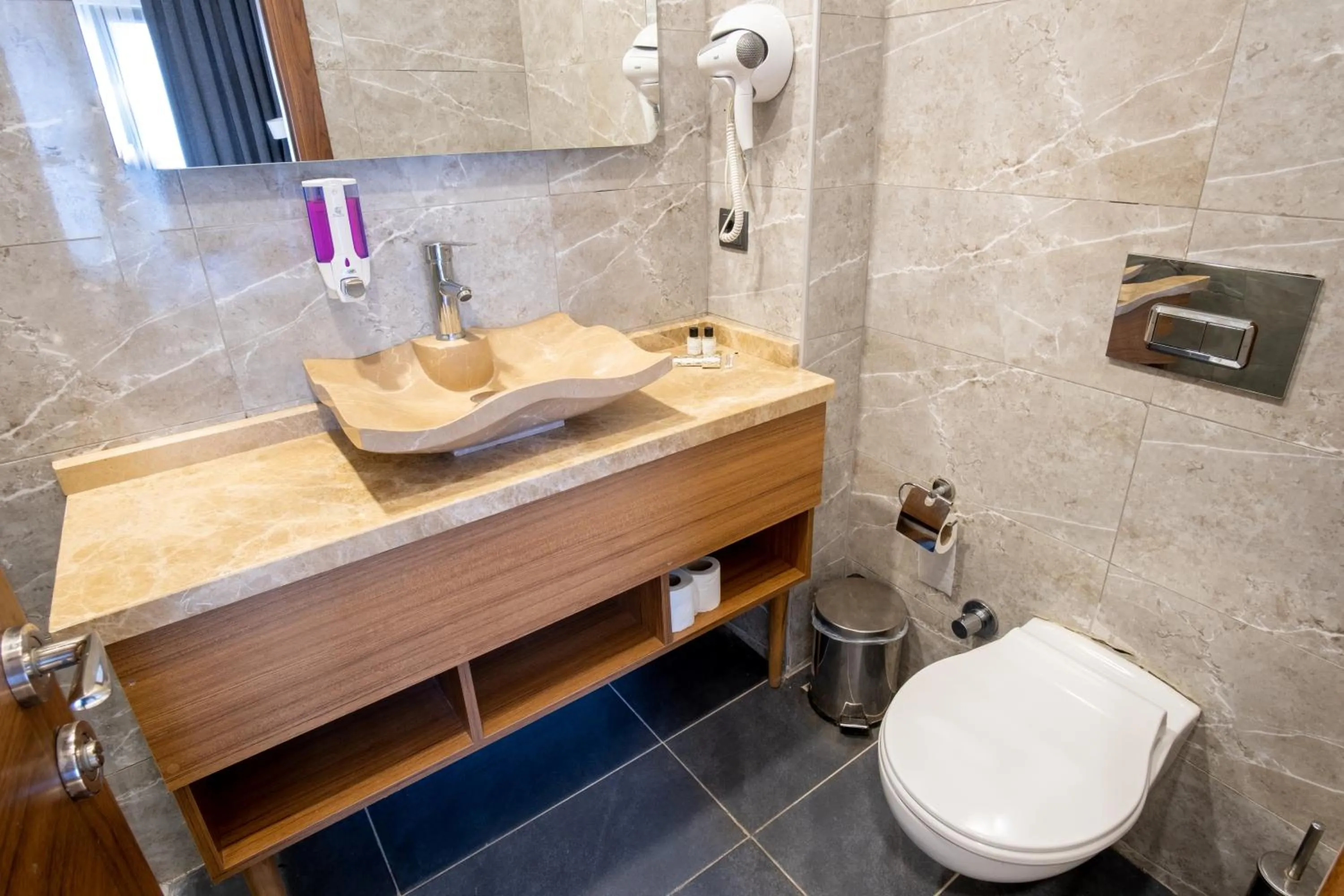 Toilet in Orange Hotel & Spa