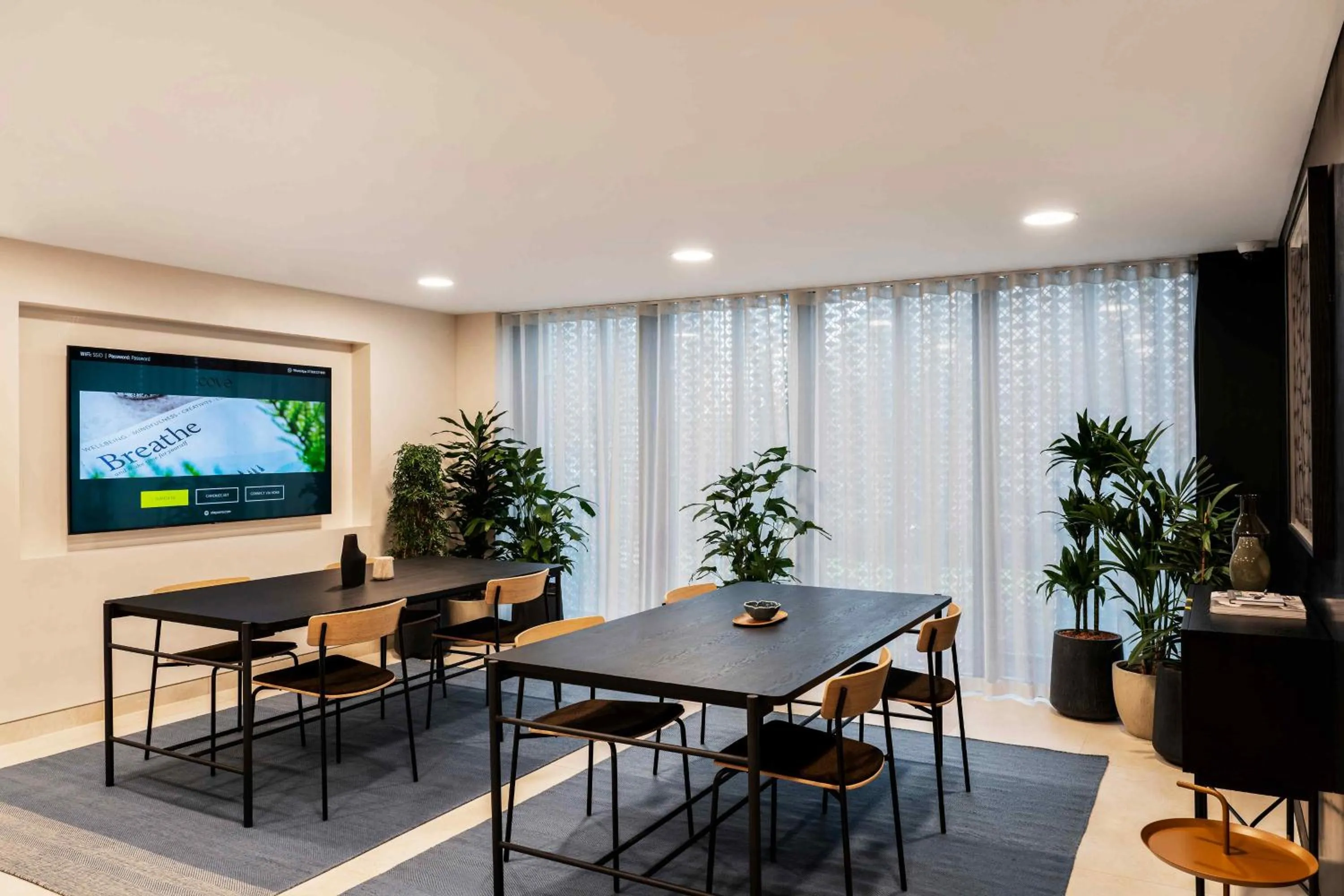 Communal lounge/ TV room in Cove Landmark Pinnacle