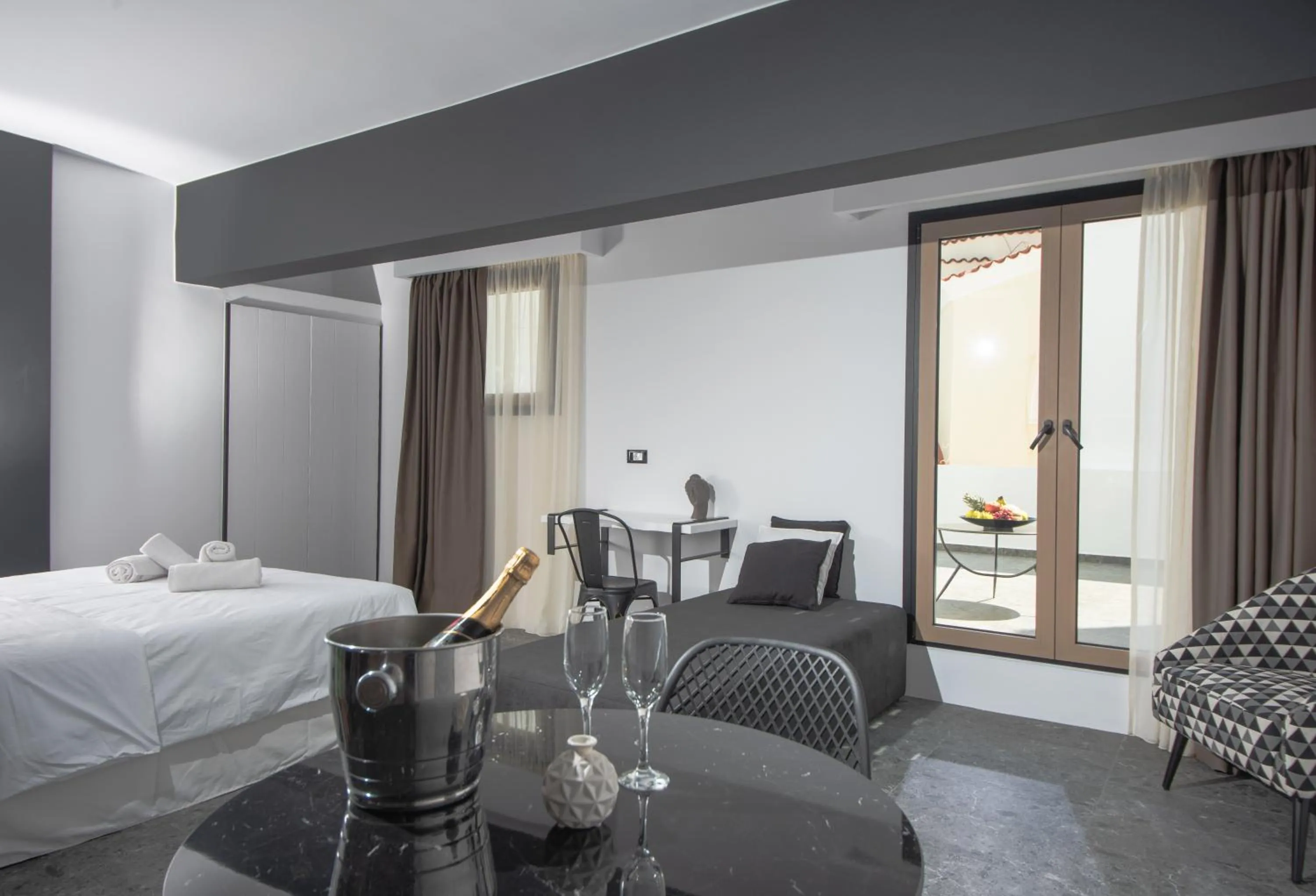 Living room, Bed in Kalypso Suites Hotel - Adults Only