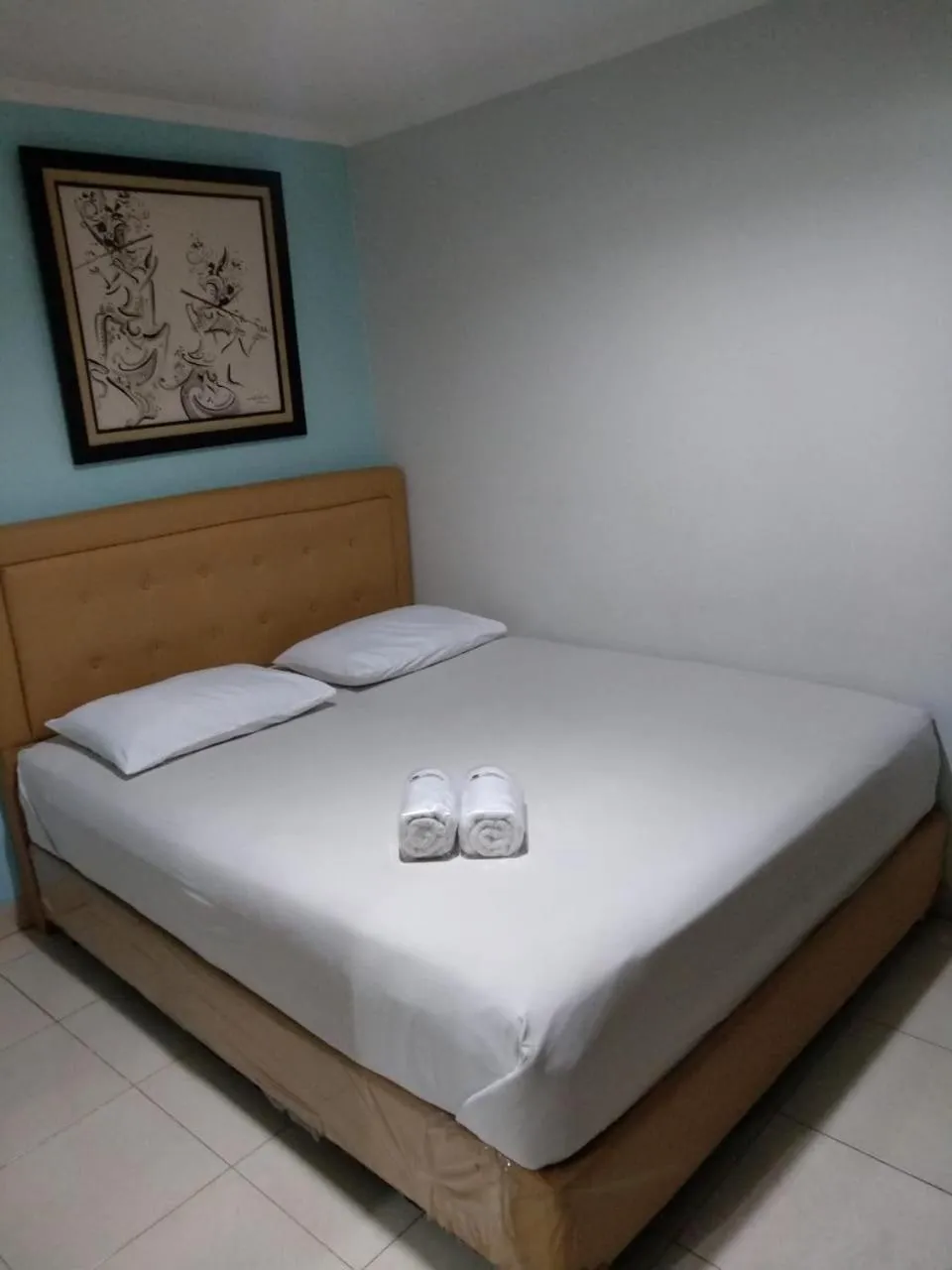 Bed in BLESSING RESIDENCE HOTEL