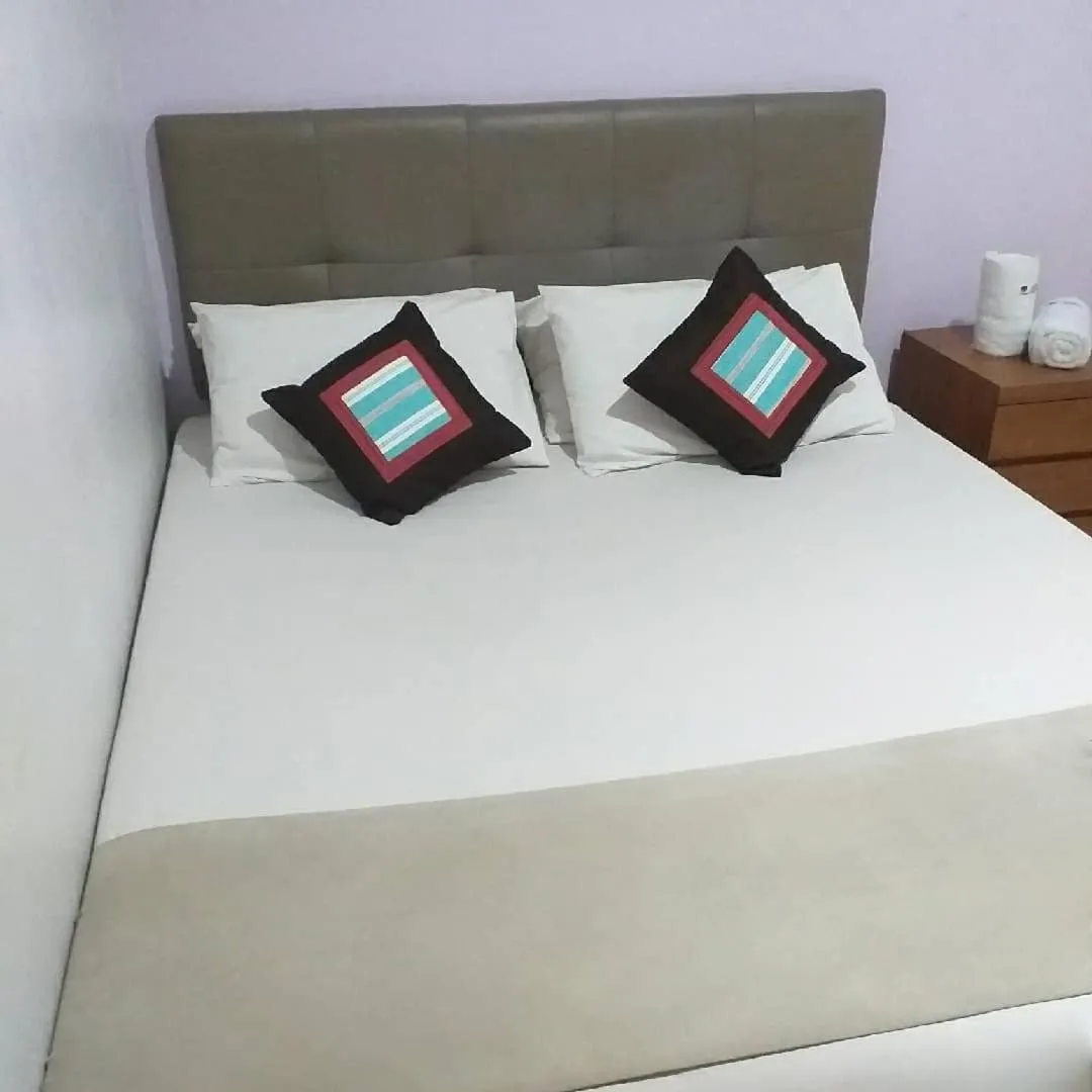 Bed in BLESSING RESIDENCE HOTEL