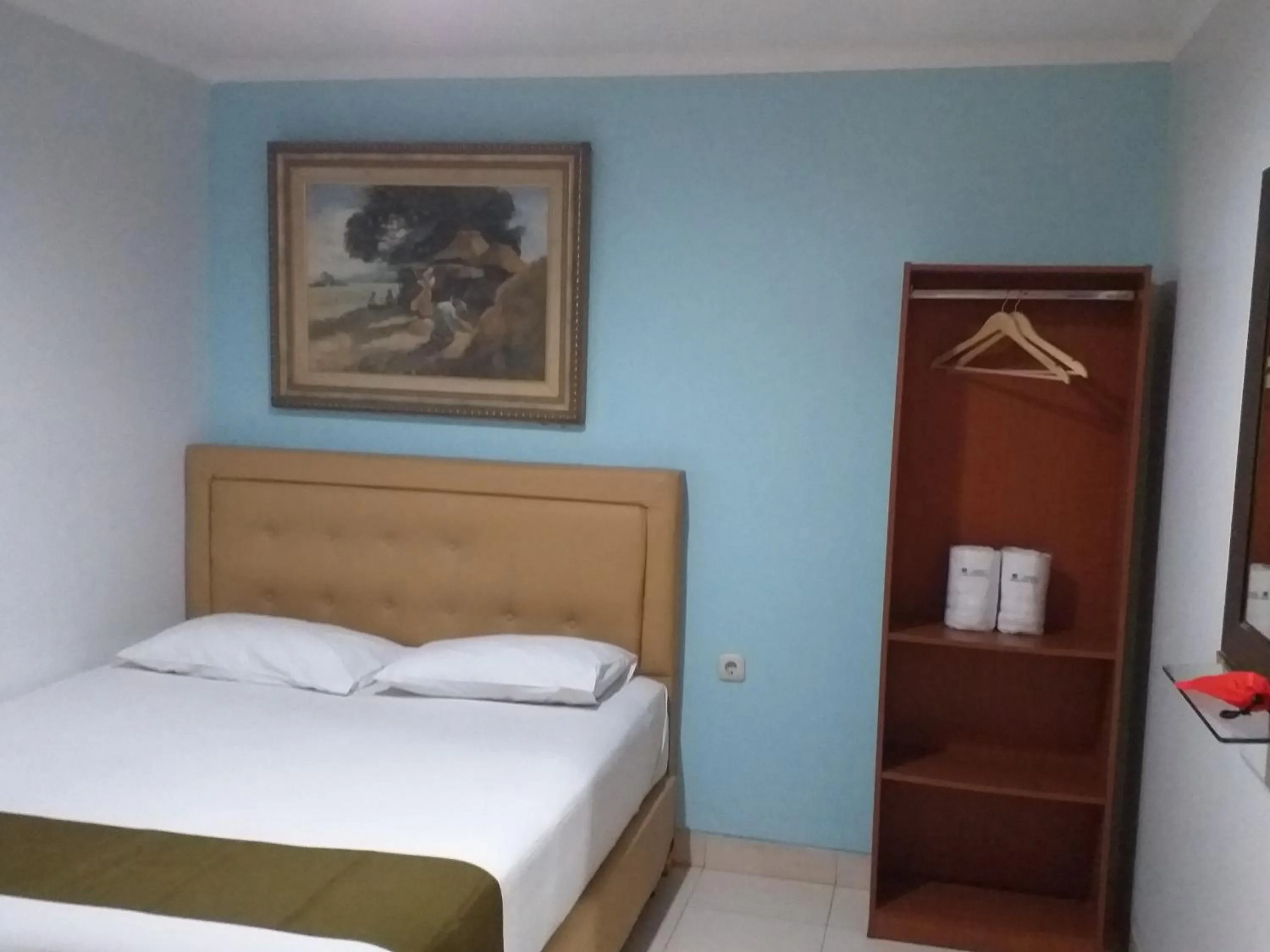 Bed in BLESSING RESIDENCE HOTEL