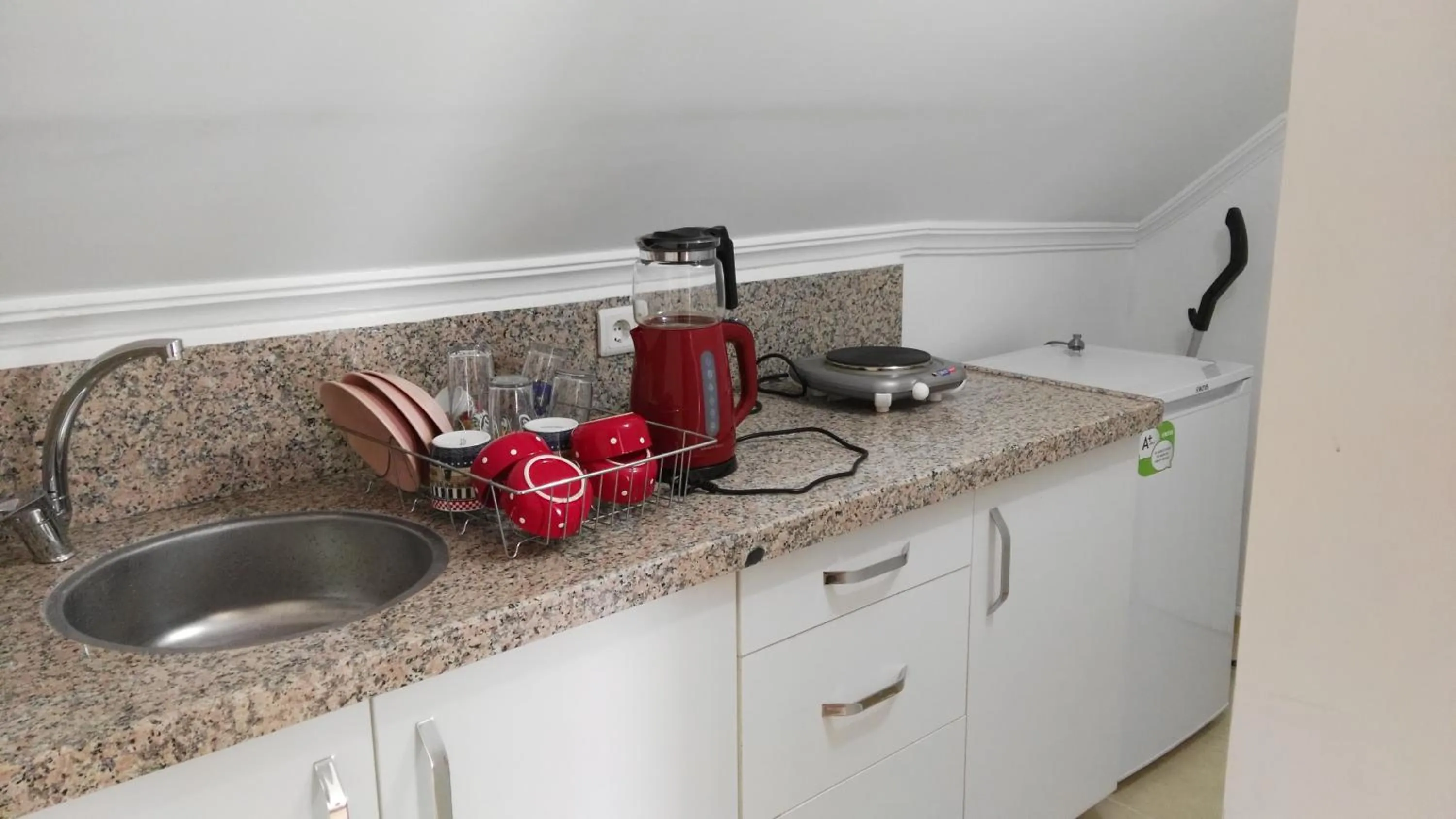 Kitchen or kitchenette in Uysal Suite and Loft Seaside