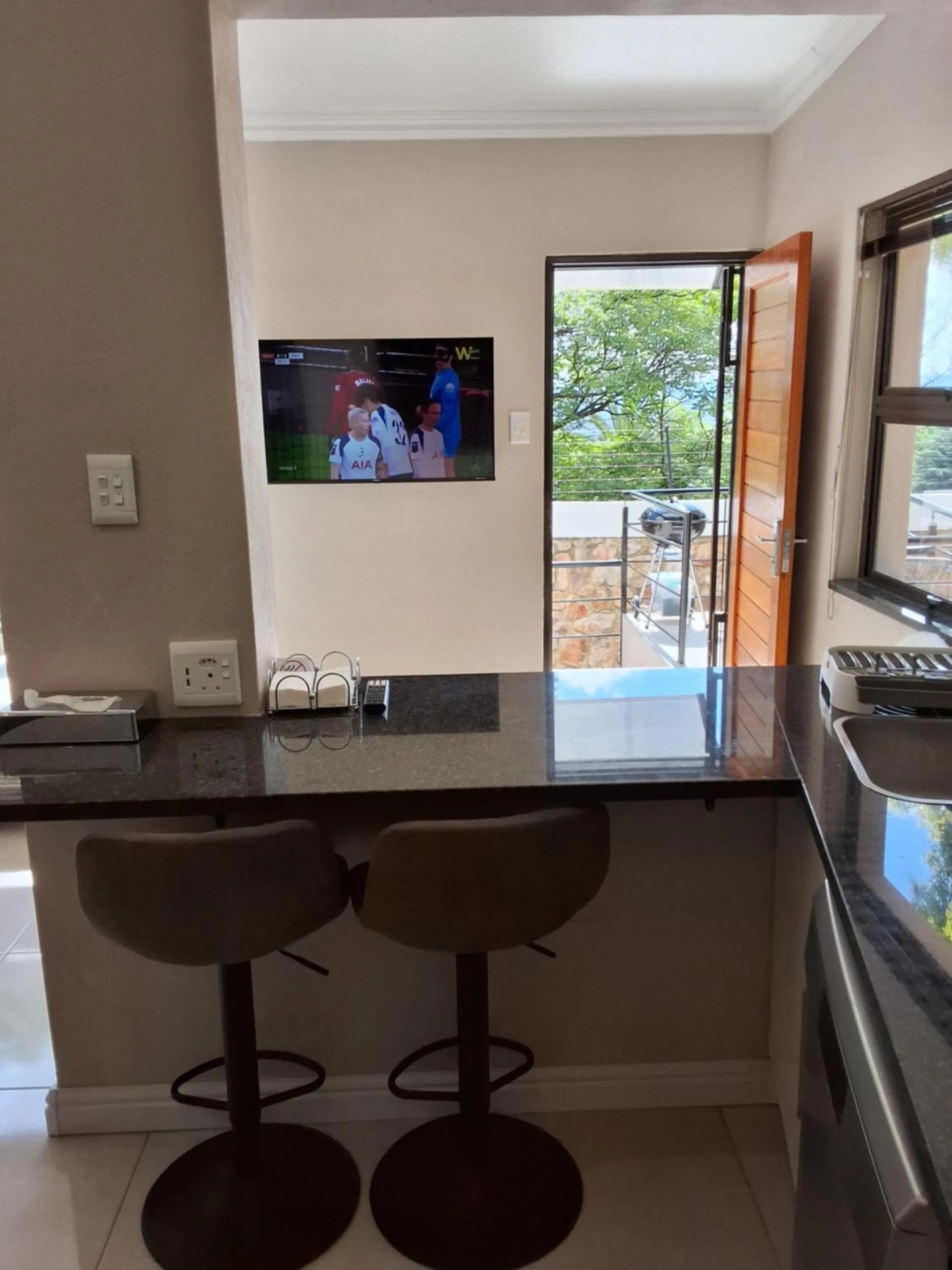 TV and multimedia in CityView, a stunning modern apartment