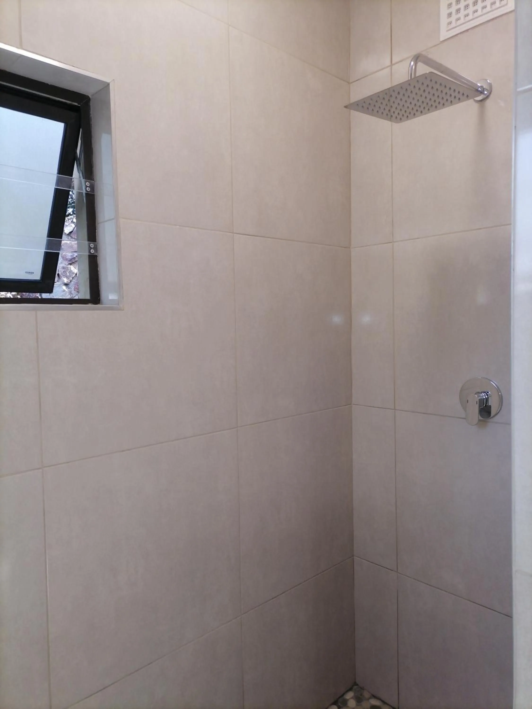 Shower in CityView, a stunning modern apartment