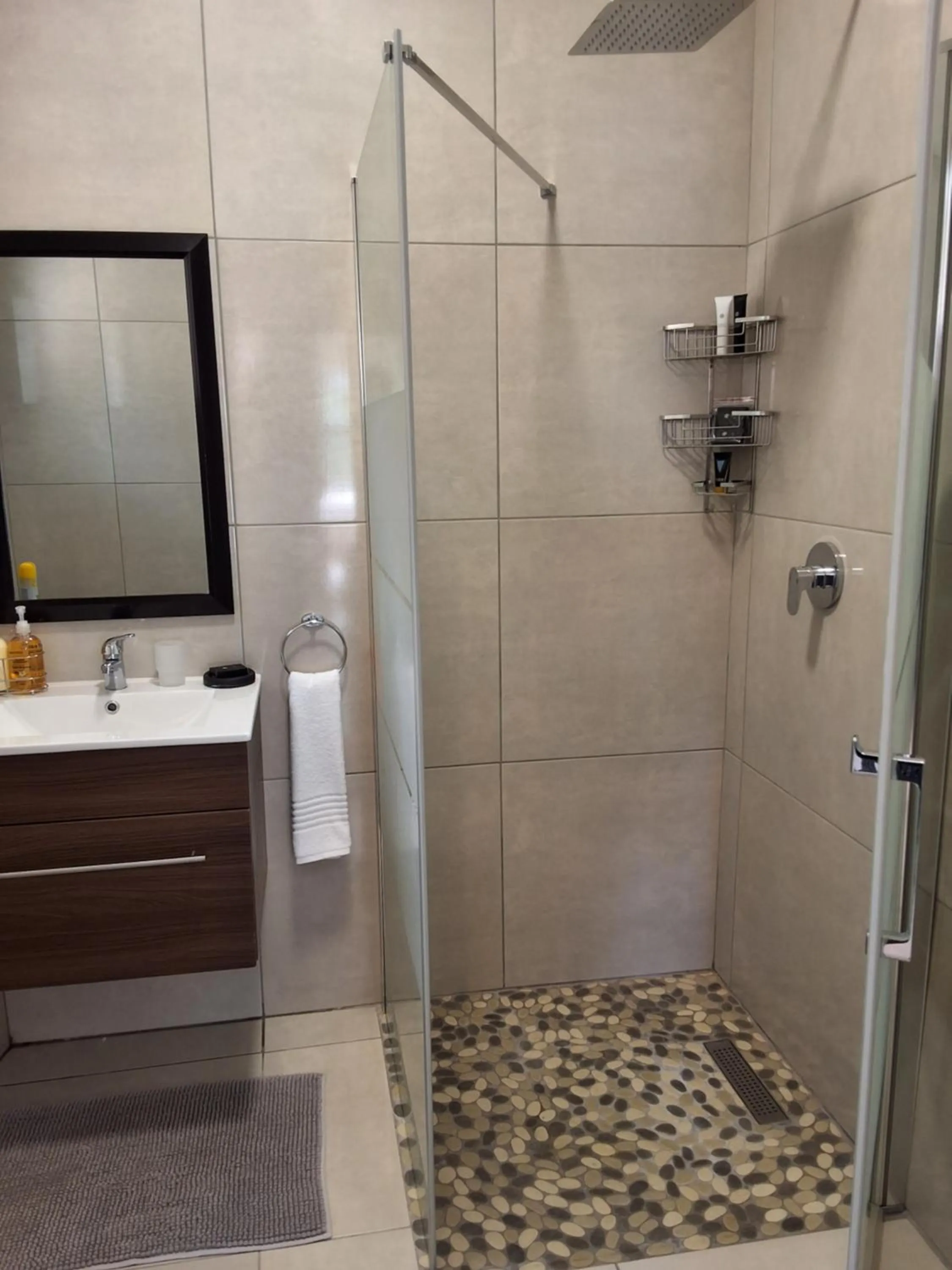 Shower in CityView, a stunning modern apartment