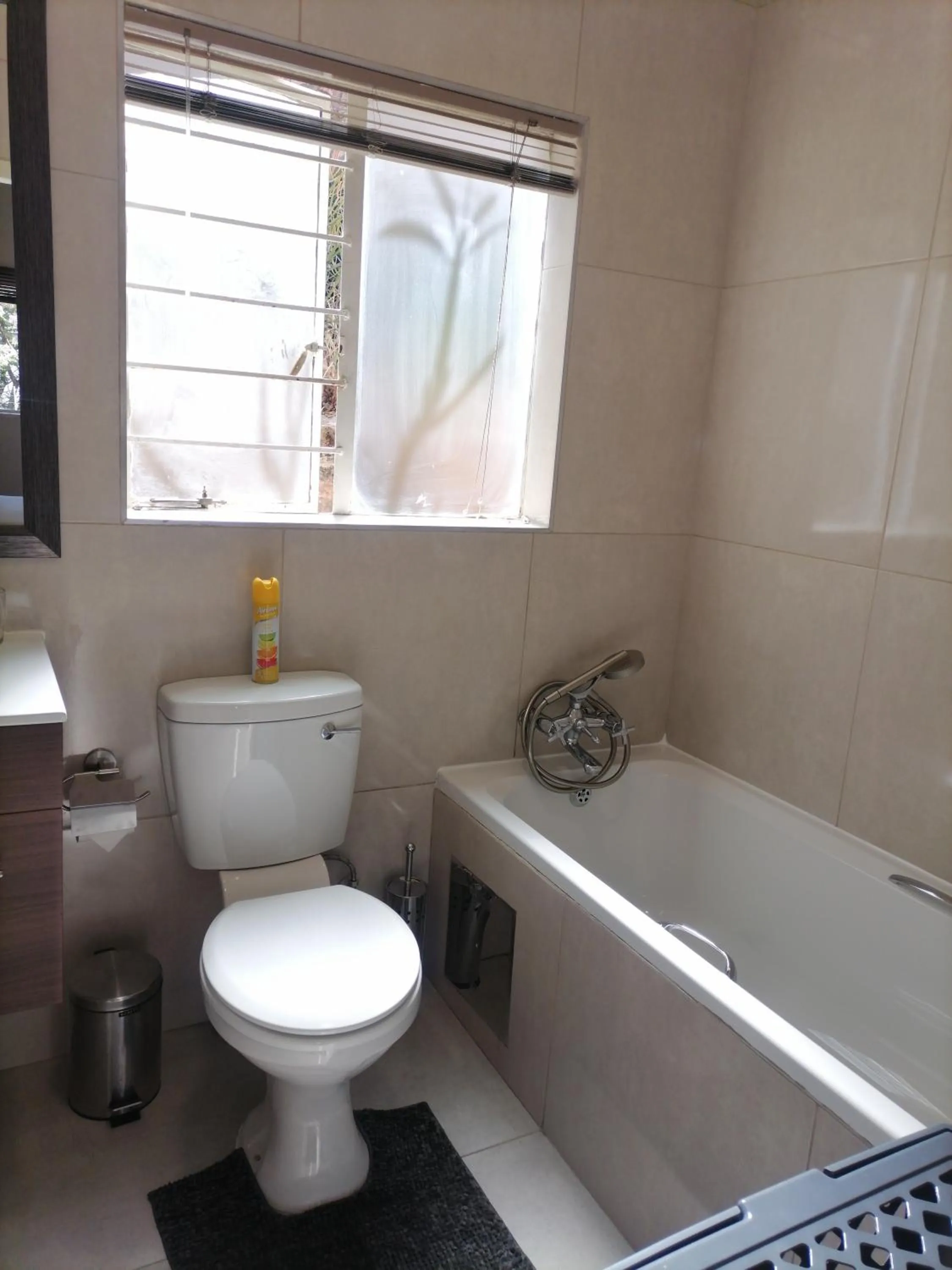 Toilet in CityView, a stunning modern apartment