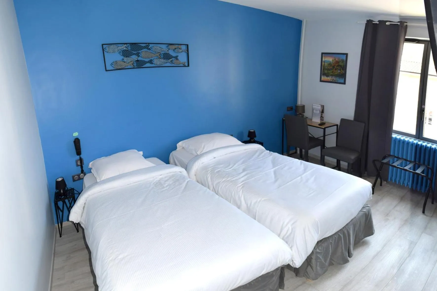 Bed in Hotel de l'Abbaye à Cluny