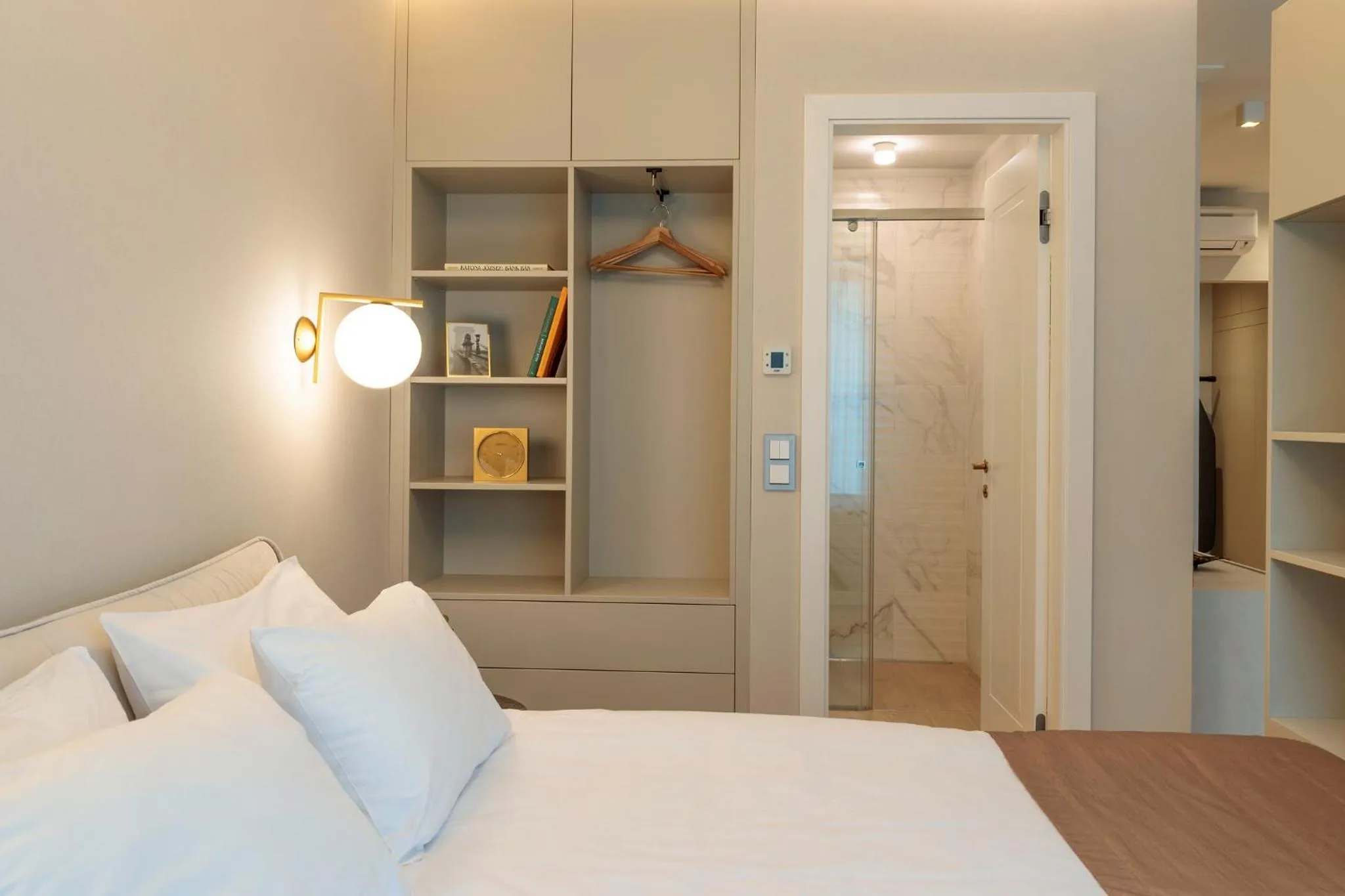 Bed in Emerald Downtown Luxury Suites by Continental Group