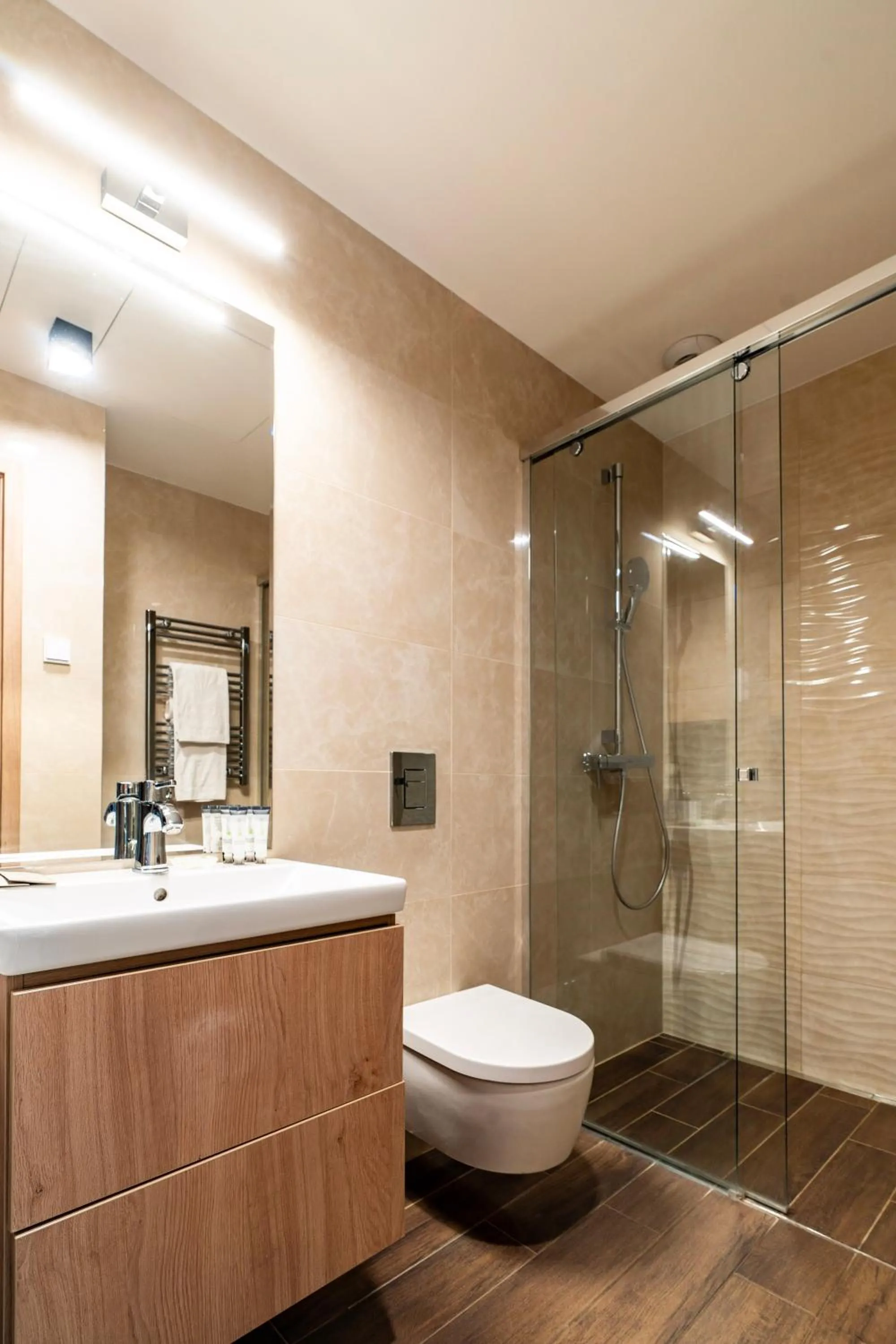 Shower in Emerald Downtown Luxury Suites by Continental Group