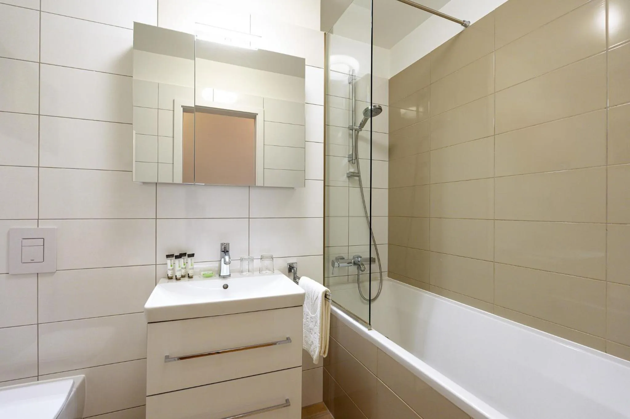 Bathroom in Emerald Downtown Luxury Suites by Continental Group