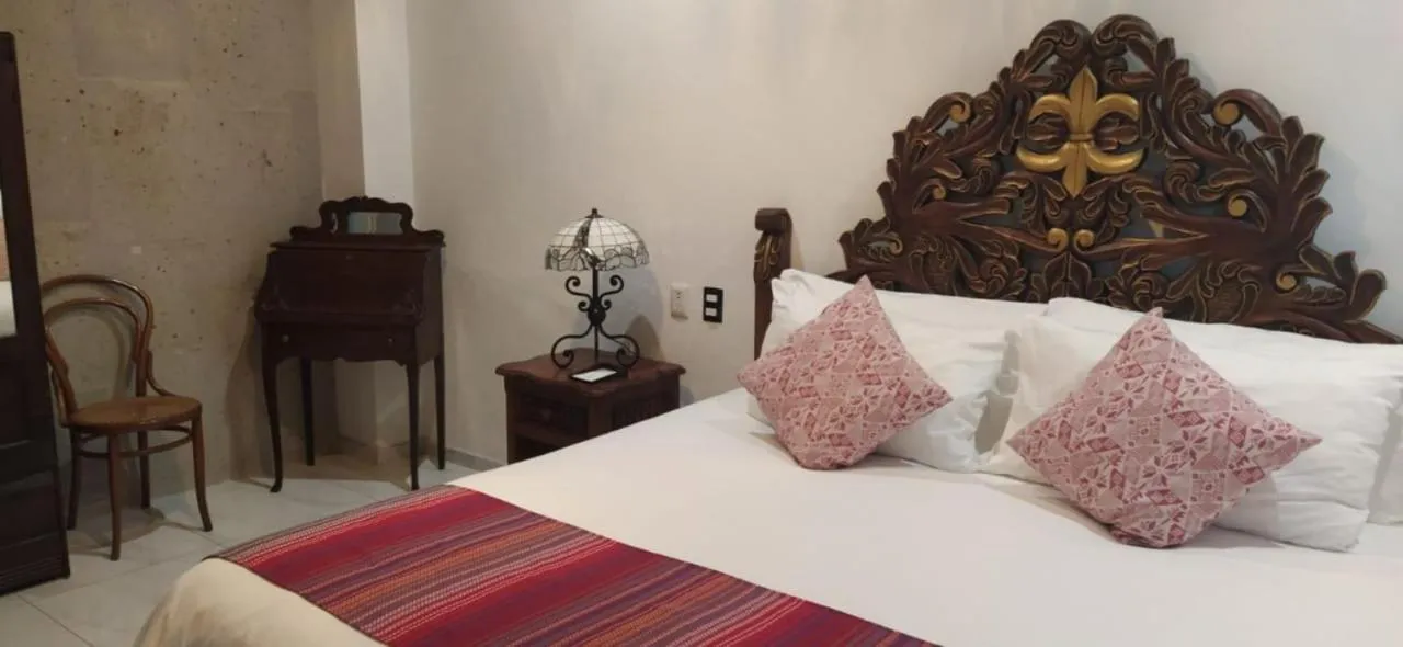 Bed in Posada de Maria Hotel Boutique & Spa