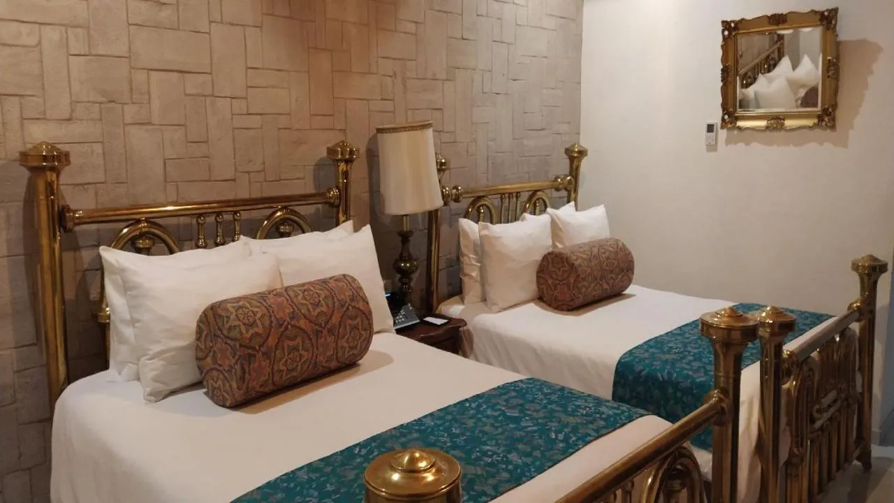 Bed in Posada de Maria Hotel Boutique & Spa