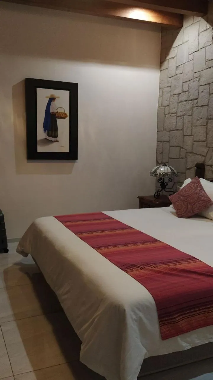 Bed in Posada de Maria Hotel Boutique & Spa