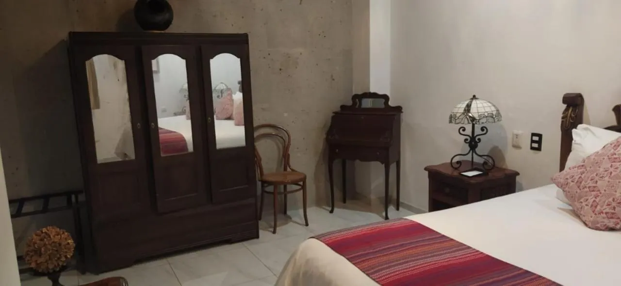 Bed in Posada de Maria Hotel Boutique & Spa