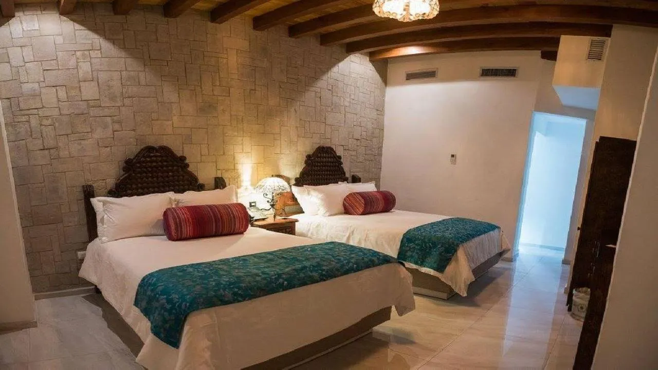 Bed in Posada de Maria Hotel Boutique & Spa