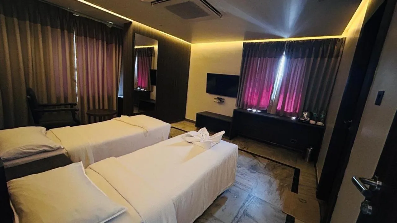 Bed in Ariya Nivaas A Vegetarian Hotel