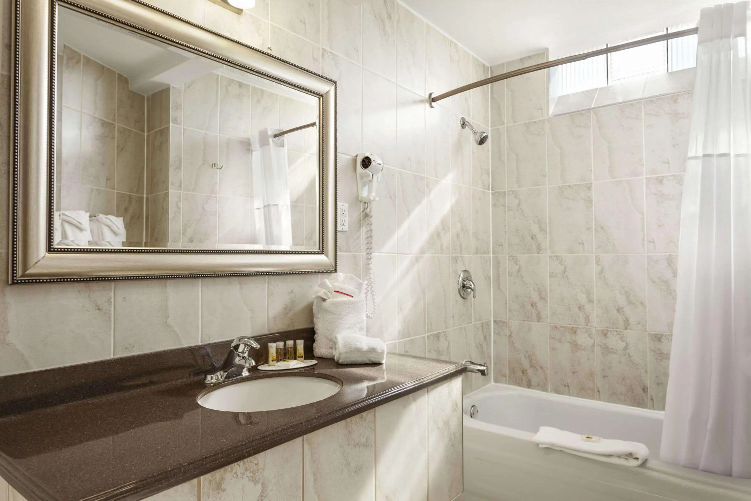 Bathroom in Days Inn by Wyndham Montreal East