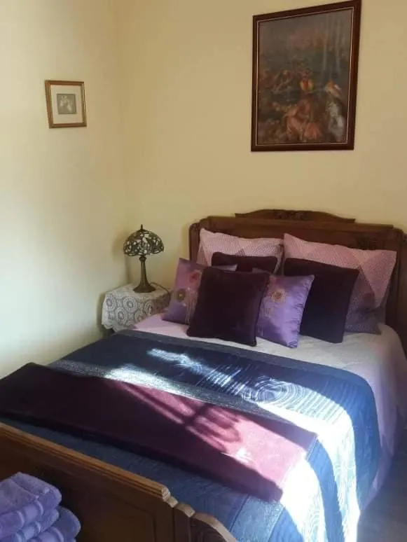 Bed in Sunset House Chambres de Hotes