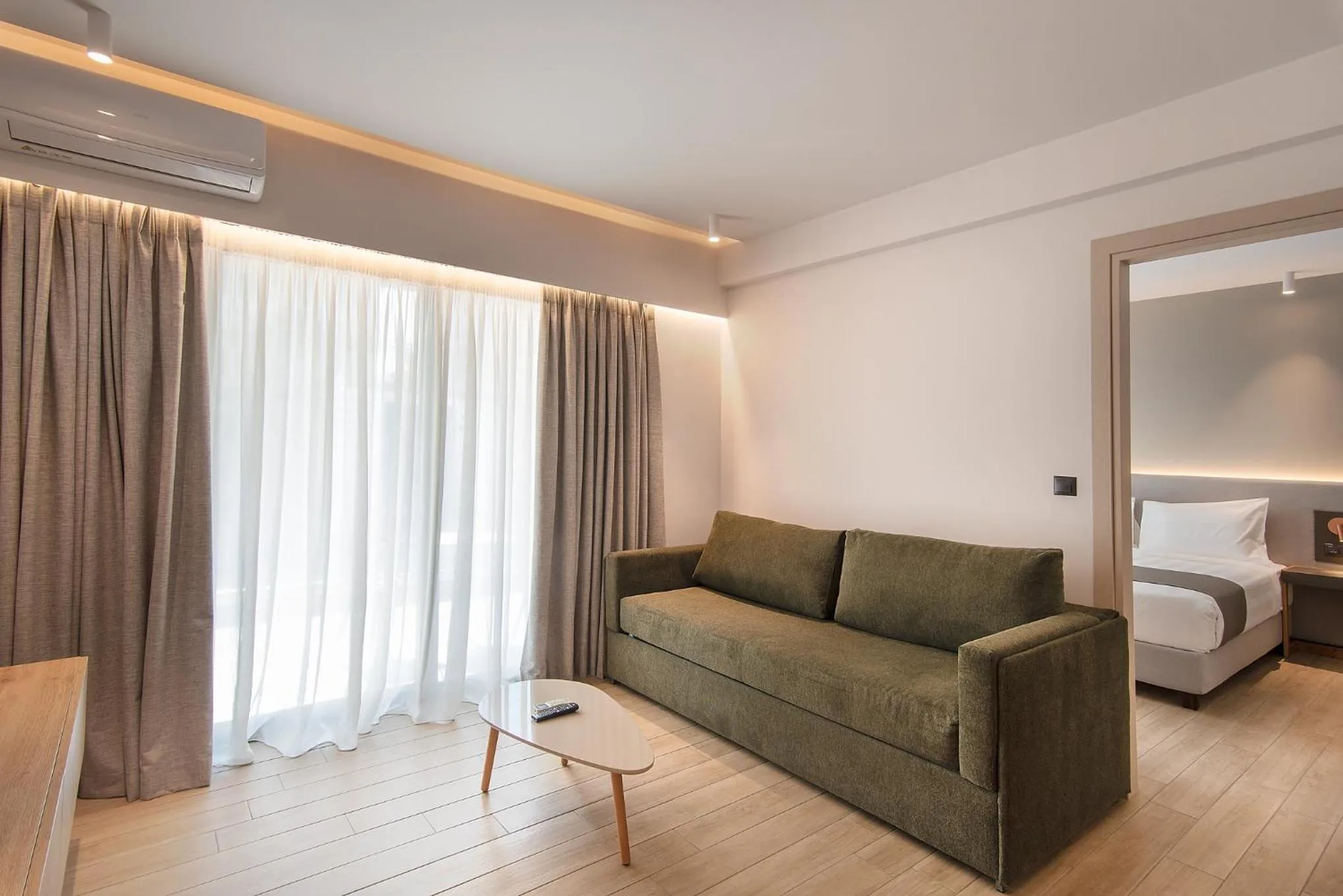 Living room, Bed in The Residences Kalamata