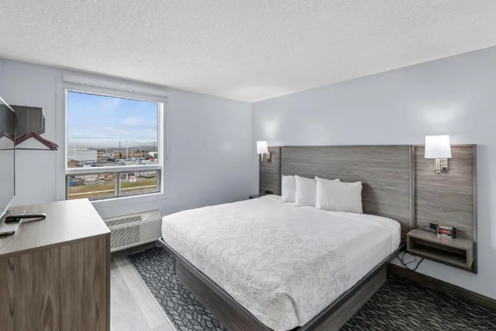 Bed in Emerald Hotel & Suites Calgary Airport