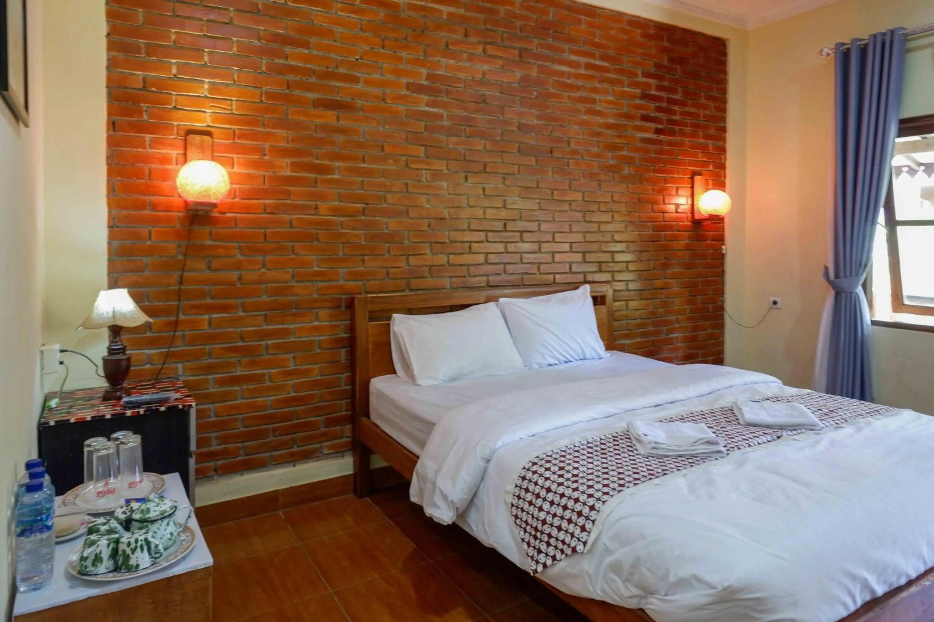 Bed in Roemah Beong Syariah at Desa Wisata Kembanglimus Mitra RedDoorz