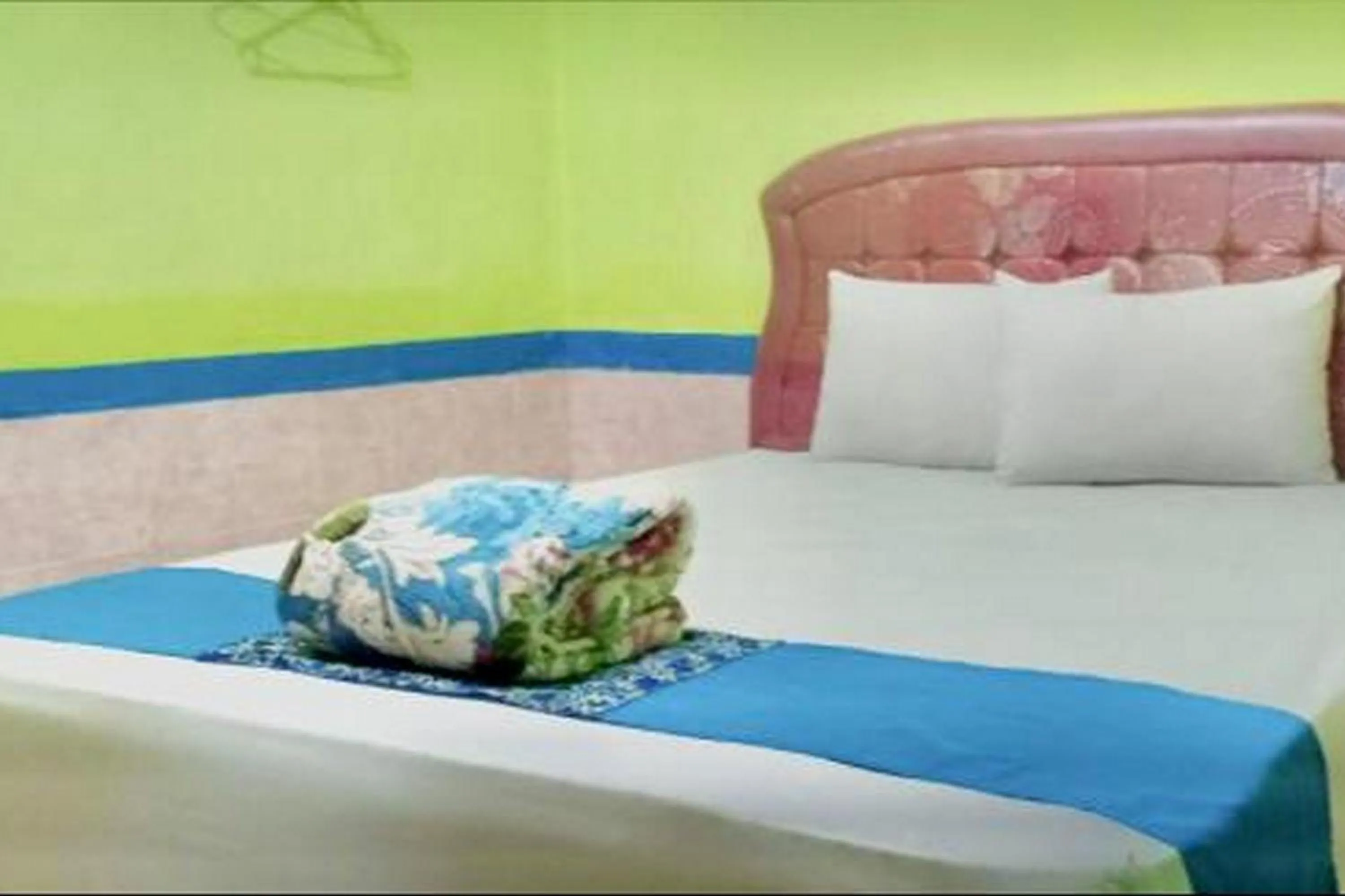 Bed in Hotel Indah Grogot Syariah Mitra RedDoorz