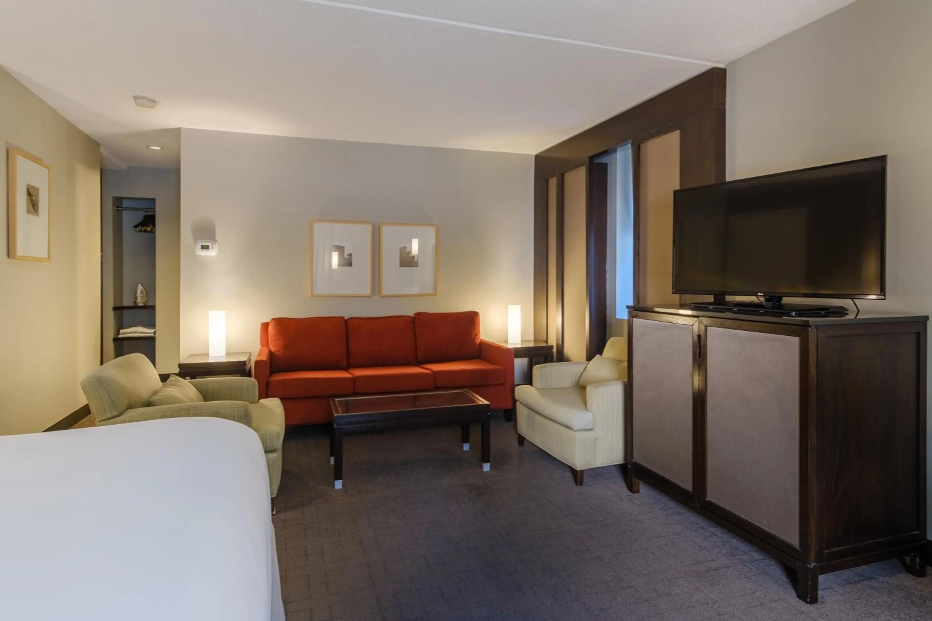 Seating area, Bed in Arc The Hotel