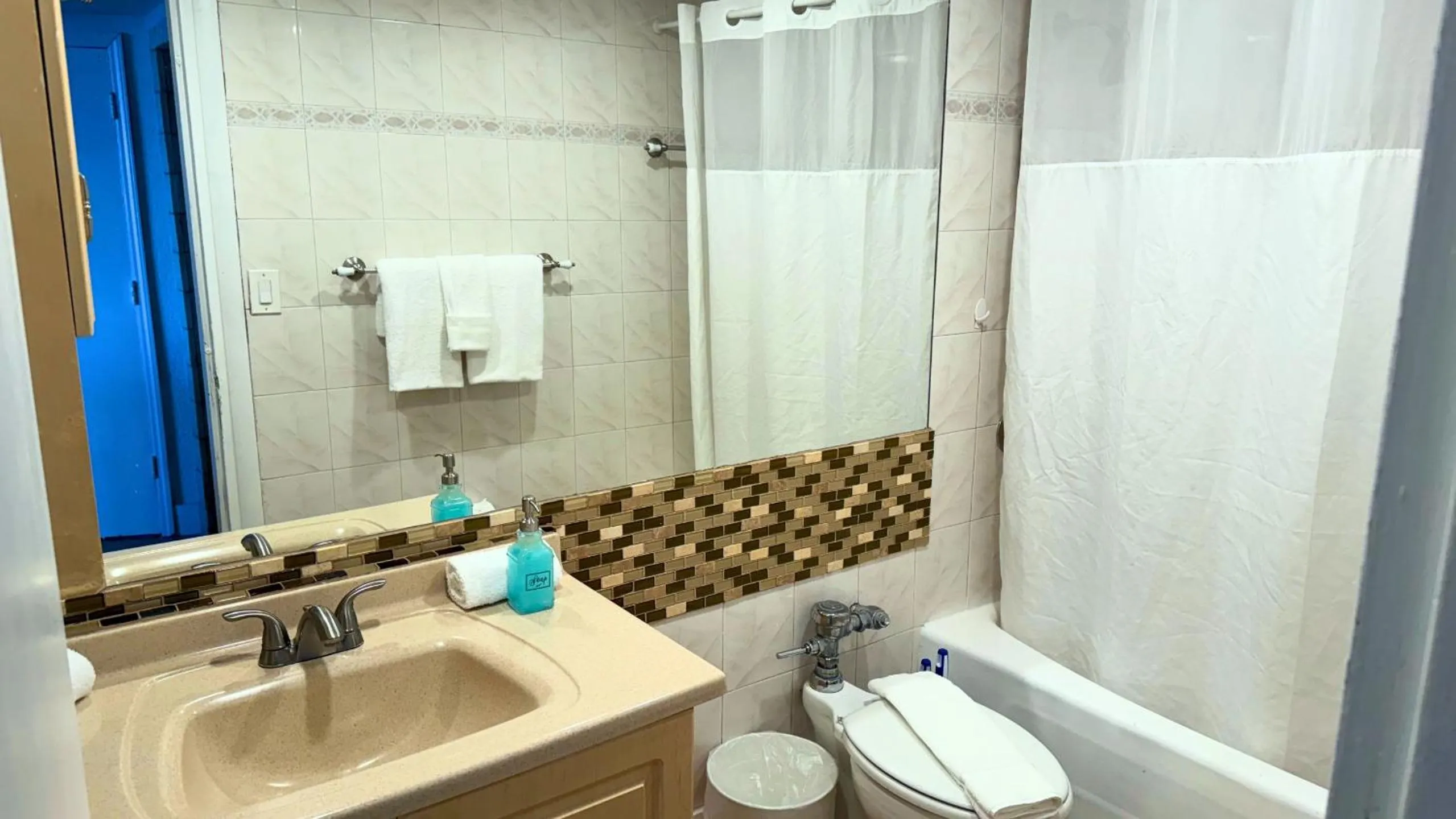 Shower in SeaStays Apartments