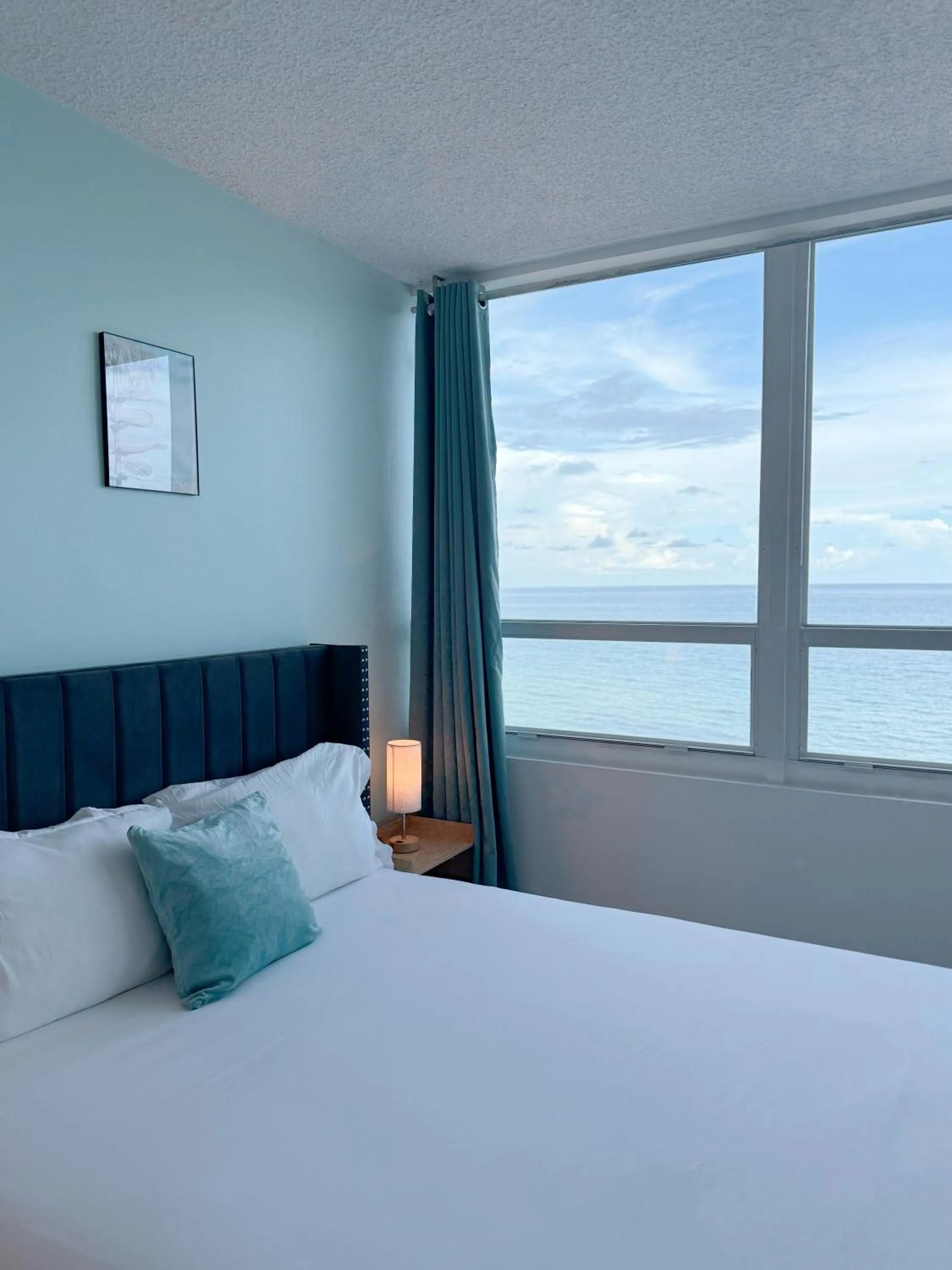 Bed in SeaStays Apartments