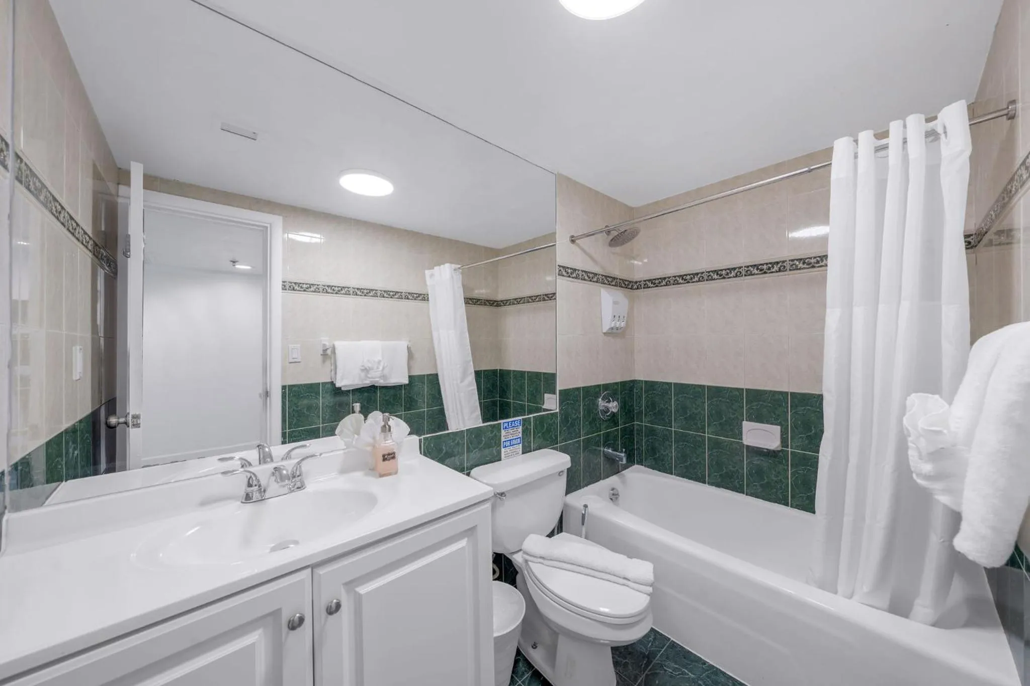 Shower in SeaStays Apartments