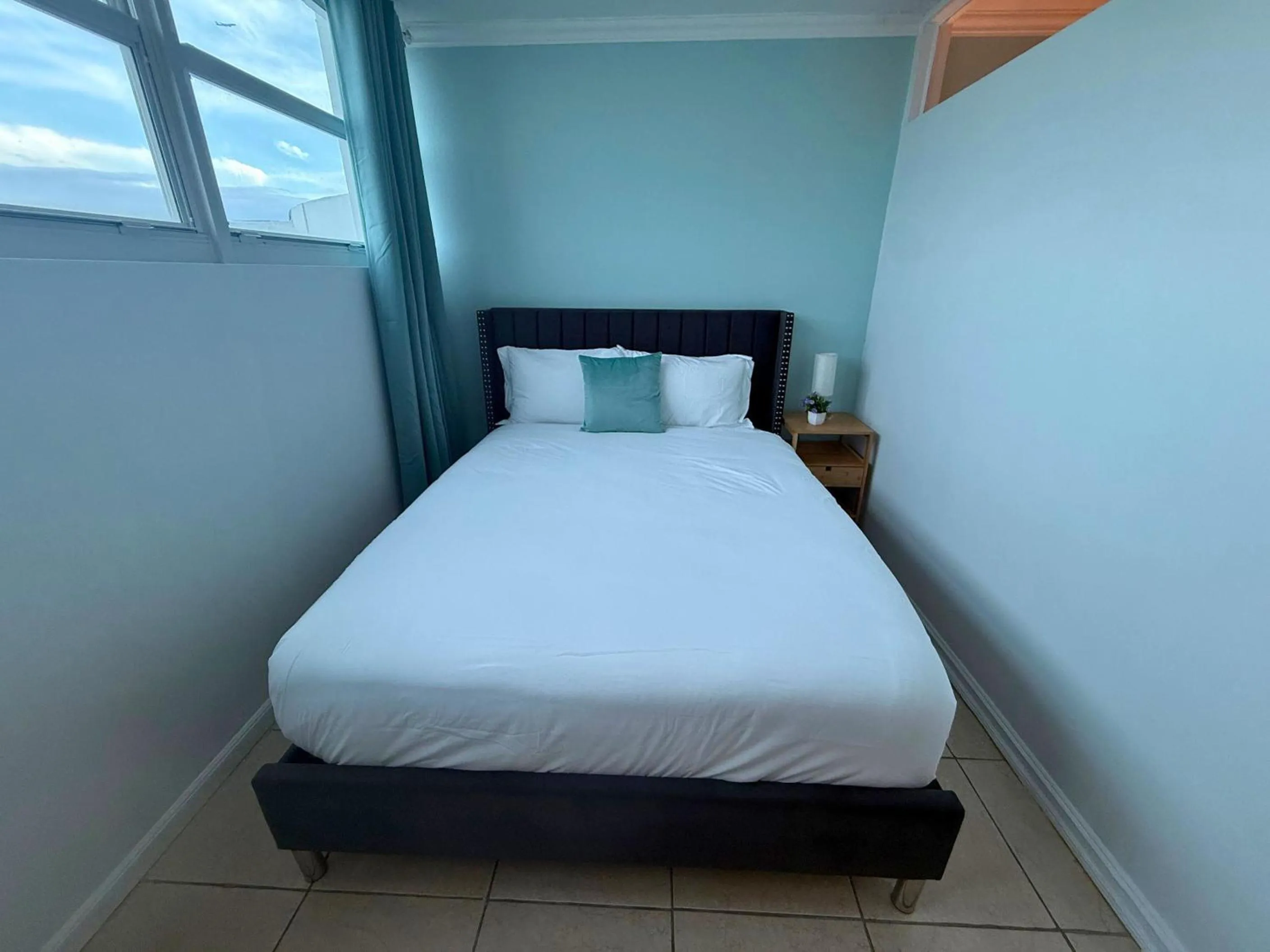 Bed in SeaStays Apartments