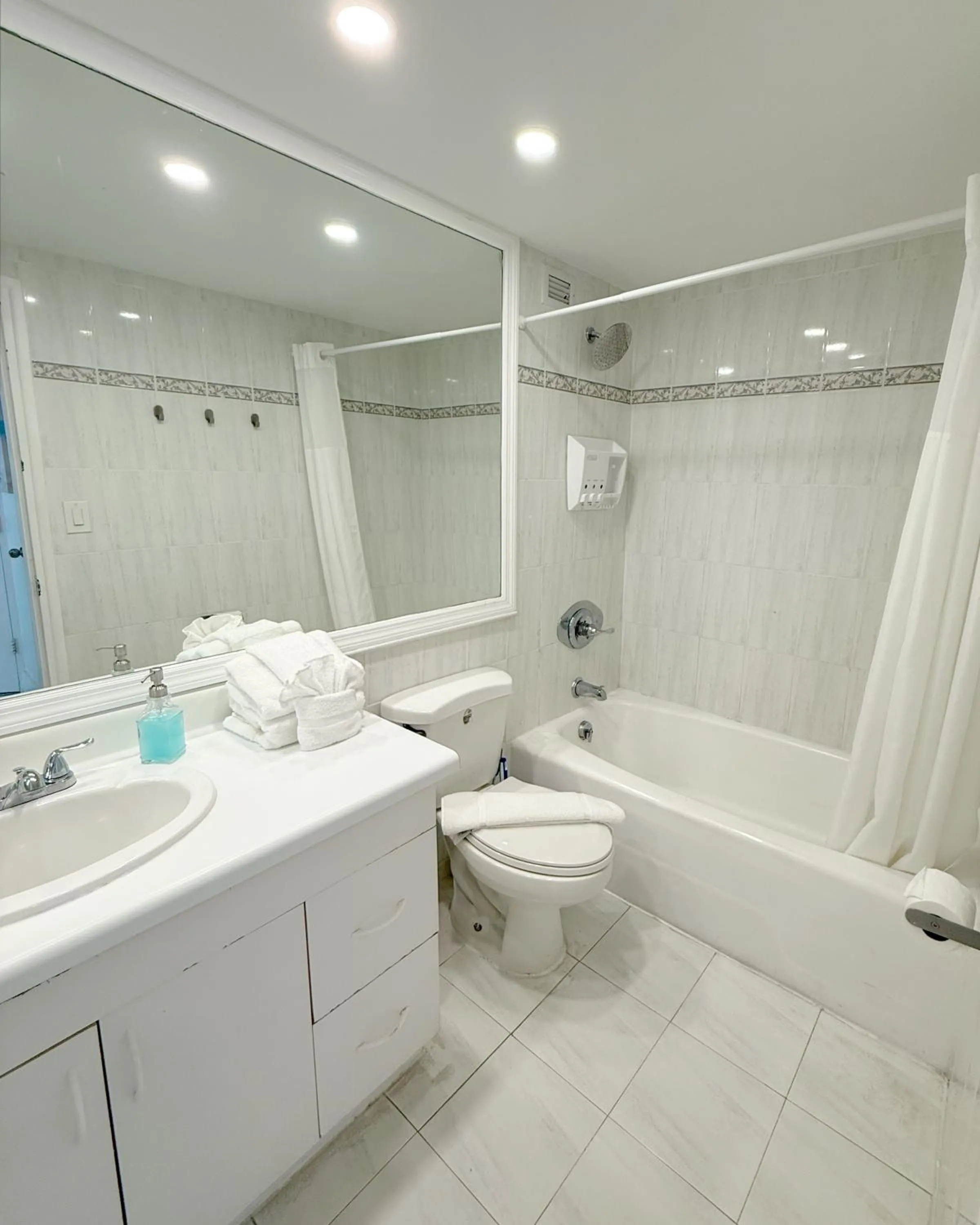 Shower in SeaStays Apartments