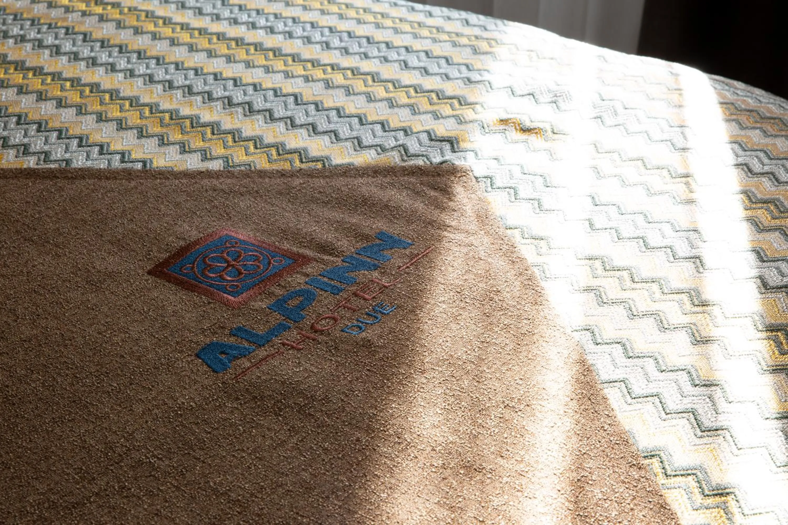 Property logo or sign in Alpinn Hotel DUE