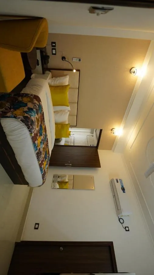 Bed in MK Hotel and Restaurant