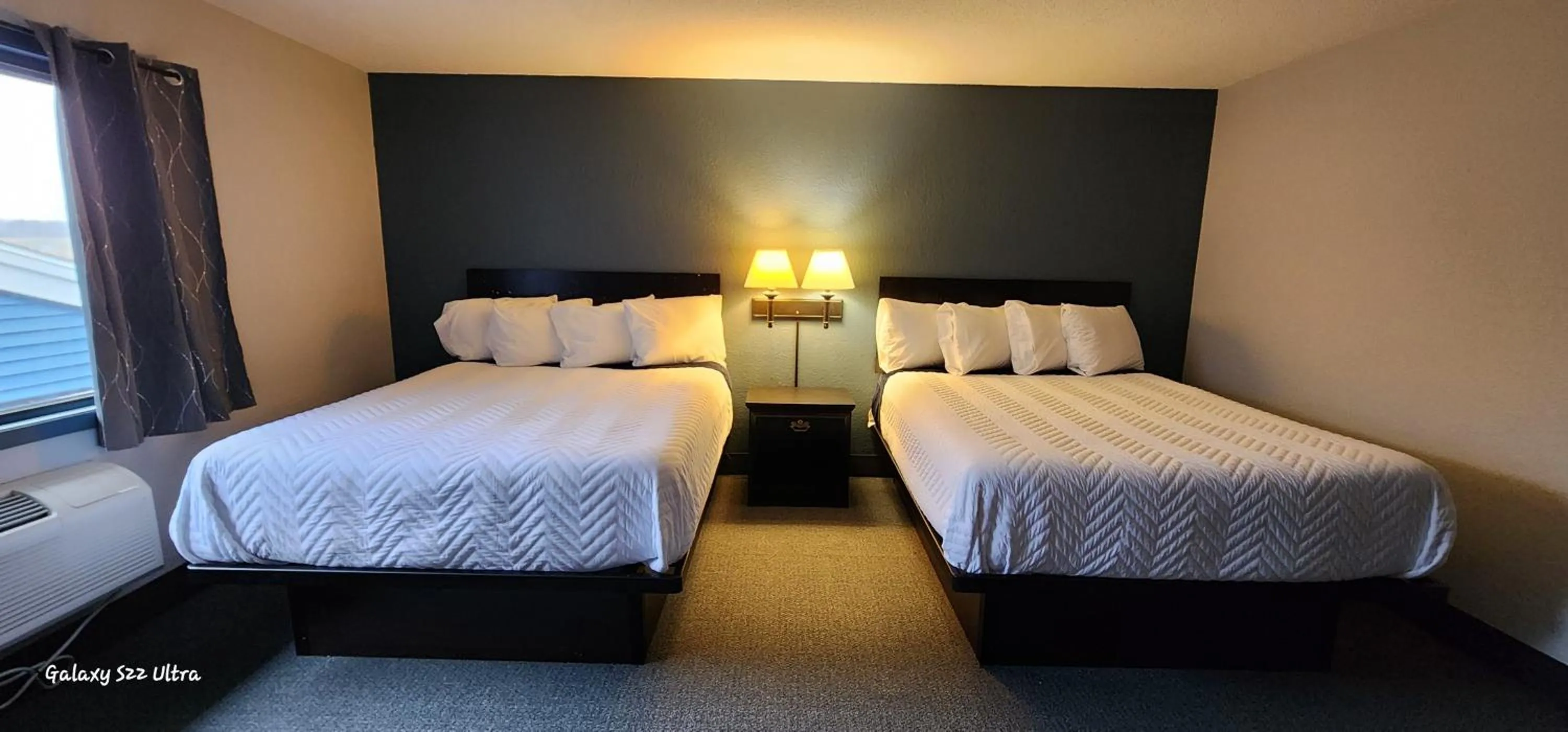 Bed in The Oasis Hotel & Bar