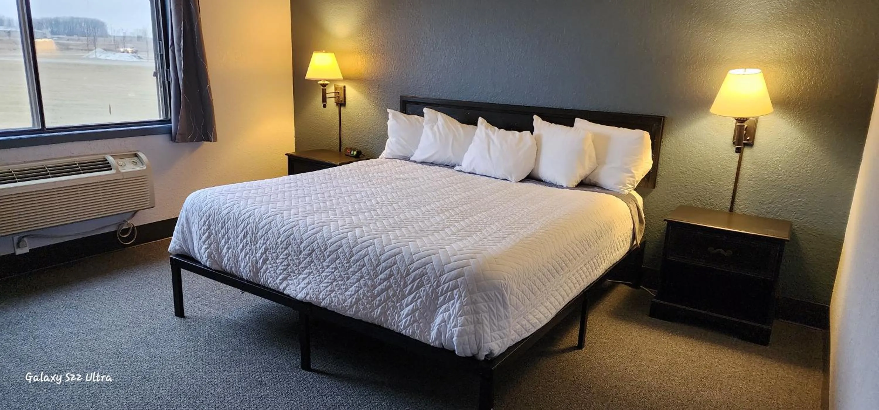 Bed in The Oasis Hotel & Bar